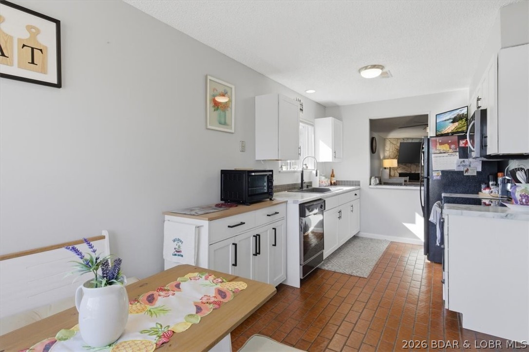 This spacious 1,500 sq. ft. 2BR/2BA condo is ideally located on HH, offering convenient access to popular waterfront and off-water restaurants and bars, shopping, medical services, marinas, movie theaters, and more. The location also puts you just steps away from two pools, tennis and pickleball courts, a playground, and scenic walking areas throughout the complex. Inside, the condo features an oversized enclosed deck that can be enjoyed year-round. Perfect for entertaining, the living room opens seamlessly to the enclosed deck through sliding glass doors, creating additional space for family and friends to gather and relax. Guests will appreciate the abundant parking, and the condo’s location next to the HOA office provides added peace of mind and security. Whether you’re searching for a full-time lake home, a weekend getaway, or an investment property with rental potential, this condo offers an excellent opportunity to enjoy lake living on The Bend. Schedule your showing today!