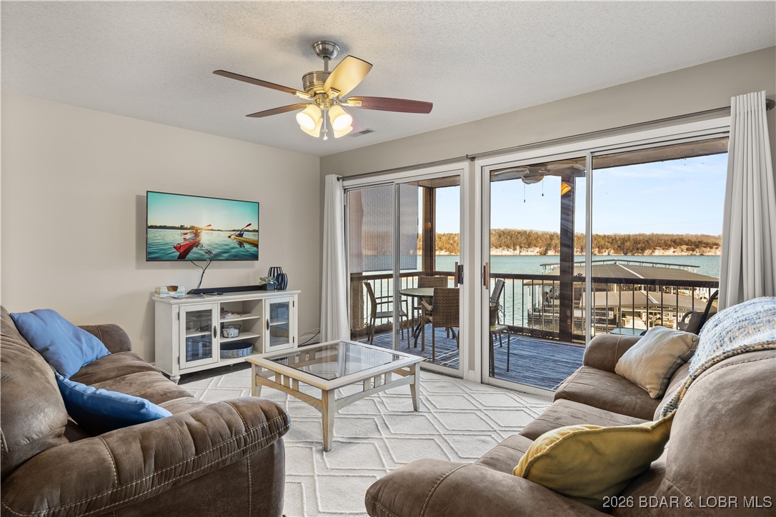 Enjoy lake life at its finest in this beautifully styled 3-bed, 2-bath lakefront retreat located in the desirable Breakwater Bay Club Condominiums at the 22-mile marker.  You’ll love the open-concept living & kitchen area, This turn-key condo is fully furnished, nightly rental approved & offers ample parking, making it an ideal investment or personal getaway. Upgrades include a screened-in porch, updated laminate flooring, modern interior doors and fixtures, & beautifully refreshed bathrooms. Natural light fills the space thanks to the expansive glass slider in the living room and oversized bedroom windows. The spacious second bedroom easily accommodates a queen & full bed, making it perfect for families or guests. The lakefront primary suite features floor-to-ceiling windows,  private bath, & direct access to the deck—an ideal spot to enjoy morning coffee or sunsets. Residents enjoy access to an oversized community pool, clubhouse, & playground, just steps away. Whether you’re seeking a relaxing retreat or a rental opportunity, this condo delivers the total lake package. *Bonus: Seller to make last two HOA payments of 2026. Don’t wait—make your lake dreams a reality!