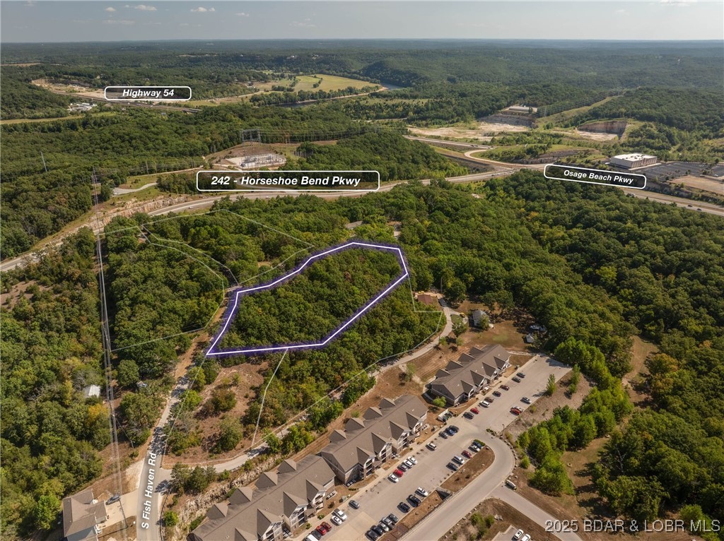 Apartments anyone? This nearly 2 acre lot is R-3 High-Density Residential and was originally intended for a 16 unit apartment building. Apartments and multifamily have proven successful in this area and with what is planned for Lake Ozark in the coming years this could be the perfect location. Gentle topography, water, sewer and great access via city roads. What else could you ask for. More like this? There is another 2+ acres that is also listed and contiguous. Your chance to build multiple buildings!