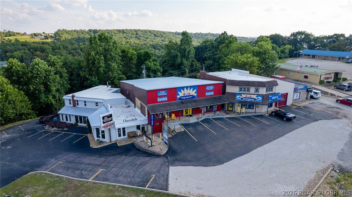 Unmatched investment opportunity in Sunrise Beach—own a highly successful, 17-year established retail business with a proven history of strong, consistent profitability. This offering includes two substantial buildings totaling over 10,000 sq ft along with operational assets—providing a solid foundation for continued success. Both properties are dual-zoned commercial and residential, creating exceptional flexibility for an investor to expand, diversify income streams, or introduce new concepts. The business is well-established with a loyal, repeat customer base and systems already in place, offering stability while still allowing a new owner to step in and elevate operations. Ownership will also have the opportunity to build upon existing vendor relationships, including access to sought-after apparel lines that are not easily secured, creating a strong competitive edge. Set within character-rich buildings dating back to the 1950s, this property combines historic charm with real income-producing potential. Prime location, established presence, and clear upside make this an exceptional opportunity for investors or entrepreneurs. More unused space photos can be provided upon request.