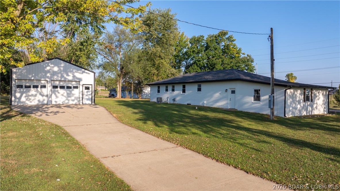 Fully Remodeled Modern Farmhouse on ~3 Acres — Move-In Ready!
This beautifully updated 3-bedroom, 2-bathroom modern farmhouse offers 1,515 sq ft of one-level living on approximately 3 acres. Enjoy a spacious living room with a cozy fireplace and a brand-new kitchen featuring custom cabinets, sleek countertops, and new appliances. The primary suite includes a private bath, with two additional bedrooms and a refreshed guest bath. A versatile bonus room is ideal for an office, den, dining area, game room, or potential 4th bedroom. Recent updates include new LVP flooring, carpet, paint, doors, windows, roof, HVAC, electrical, sump pump, gutters, and soffits. The exterior features freshly painted white brick with black and wood accents for standout curb appeal. The property includes a 444 sq ft attached garage plus a 25'6" x 40' shop—perfect for vehicles, hobbies, lake gear, or RV storage. The 1,136 sq ft unfinished lower level offers additional storage and the laundry area. Plenty of open space allows for a large garden or outdoor activities. Turnkey, stylish, and ready to enjoy.