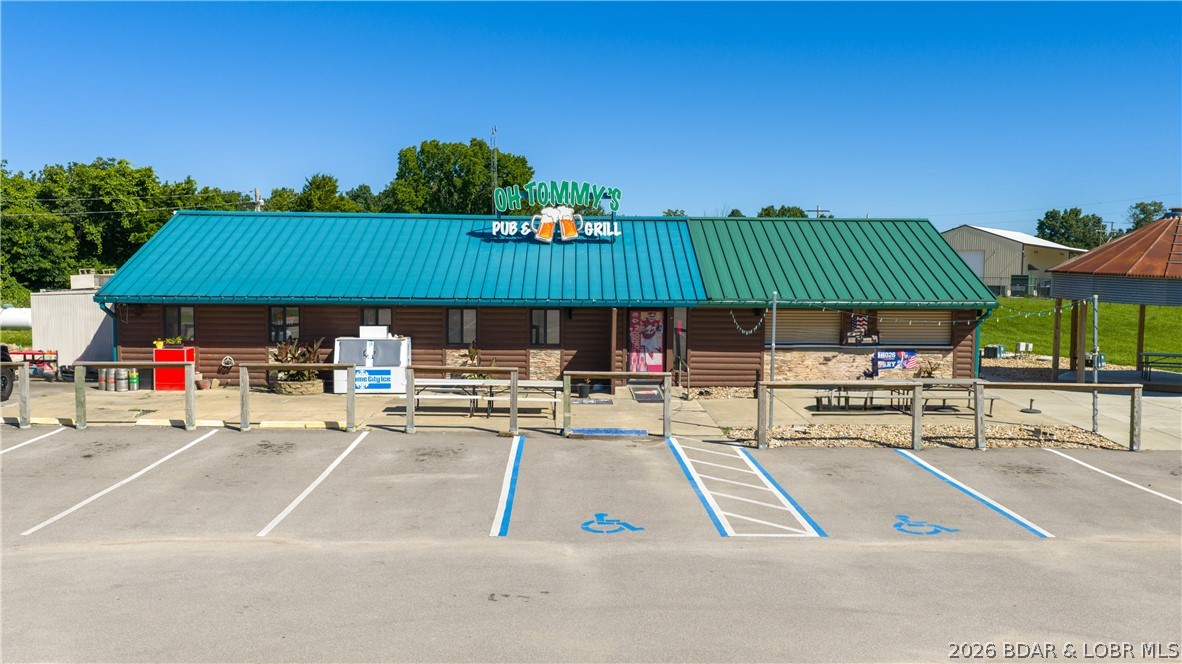 Own an established piece of the lake with no restaurant competition for miles! With an incredible reputation, this is an outstanding turnkey opportunity to own a thriving year round business. Recent updates & improvements throughout mean you can step in & start operating from day one with staff/manager in place. The fully equipped commercial kitchen is designed for high-volume with  3 walk-in coolers with a spacious dining room & bar area with seating for 80 guests or more. Additional features include a private office, ample storage & Two New restrooms with the new recent addition. Outside, guests can enjoy generous outdoor seating & entertainment space for bands, complemented by a newly asphalted parking lot with 50 new parking spaces. Whether you're an experienced restaurateur looking to expand or an entrepreneur ready to make your mark at the Lake, this property offers endless potential. For even greater possibilities, the neighboring office complex, rental space or event center is also available for purchase, creating an exceptional opportunity to host weddings, parties, corporate events & more.  See MLS #3588251 for more details on the adjacent 6000 sq ft building.