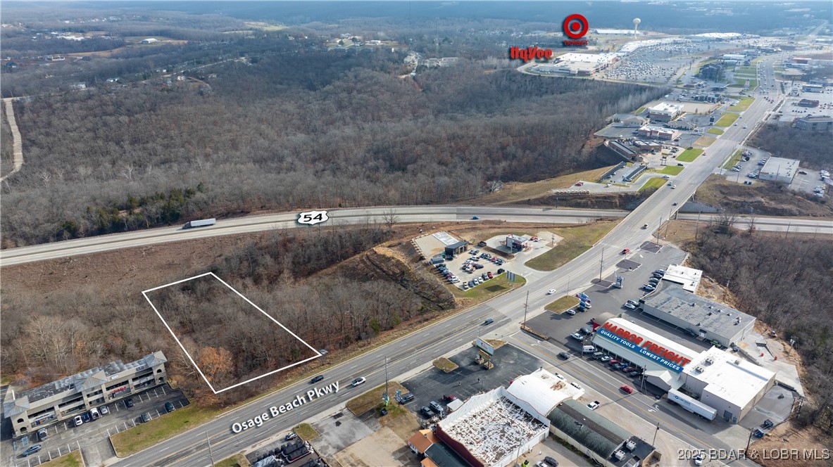1.6 Acres of commercial property in Osage Beach. This lot is priced right and offers 150ft of Osage Beach Pkwy frontage AND lot backs up to Hwy 54 for more exposure. Zone c-1 commercial. Great opportunity right near Scooters, Wendy's, Taco Bell and Across the street from Harbor Freight. Can Purchase the Neighboring lot to make a total of 3.15 Acres!