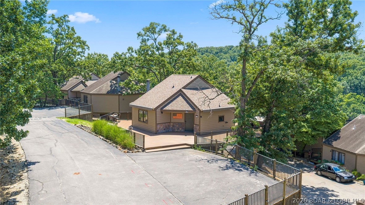 Welcome to this beautifully updated 3-bedroom, 2.5 bath, 3rd-tier villa offering just over 1,500 square feet of comfortable living in the heart of Lake of the Ozarks! Ideally located just minutes from the area's best shopping, restaurants, entertainment, and lake attractions, this property is perfect as a full-time residence, weekend getaway, or investment opportunity.
Enjoy the convenience of a large parking area and an easy walk-in entrance. Inside, you'll find several tasteful updates throughout, creating a move-in-ready space that's also turnkey for short-term rentals.
Step outside to the expansive wraparound deck—an ideal spot for entertaining, relaxing with friends and family, or enjoying your morning coffee surrounded by the beauty of the lake area.
The community offers outstanding amenities, including a swimming pool, splash pad, swim dock, playground, and more, providing fun and recreation for all ages.
Whether you're looking for your own lake retreat or a property with excellent short-term rental potential, this villa checks all the boxes! *Boat slip available for additional purchase.