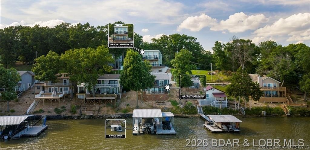 Rare opportunity to own both a lakefront home and a newly constructed second-tier guest house at the 27MM! This unique package offers endless possibilities—live in one and rent the other, create the ultimate family compound, or enjoy extra space for family and guests. The lakefront home features 3 bedrooms, 2 baths, breathtaking main channel views, deep water, an open-concept layout, wood-burning fireplace, walls of windows, two lakeside decks, a martini deck, deep-water, and a rough water dock with a 14x30 slip that can be converted to a 34ft. Conveniently located near many of the lakes fun establishments like; Margaritaville, Paradise, Fish & Co, Millers Landing and more. The 2025-built second-tier home offers 1 bedroom, 1.5 baths, vaulted ceilings, LVP flooring, granite countertops, stainless steel appliances & floor-to-ceiling windows to show the incredible lake views, plus 2 large decks with Trex decking to enjoy it.  The 2 car garage is incredible! Oversized, temperature-controlled, completely finished.. Might be too nice to park your car in.  The combination of homes provides lots of parking. A rare Lake of the Ozarks investment and lifestyle opportunity all in one package!