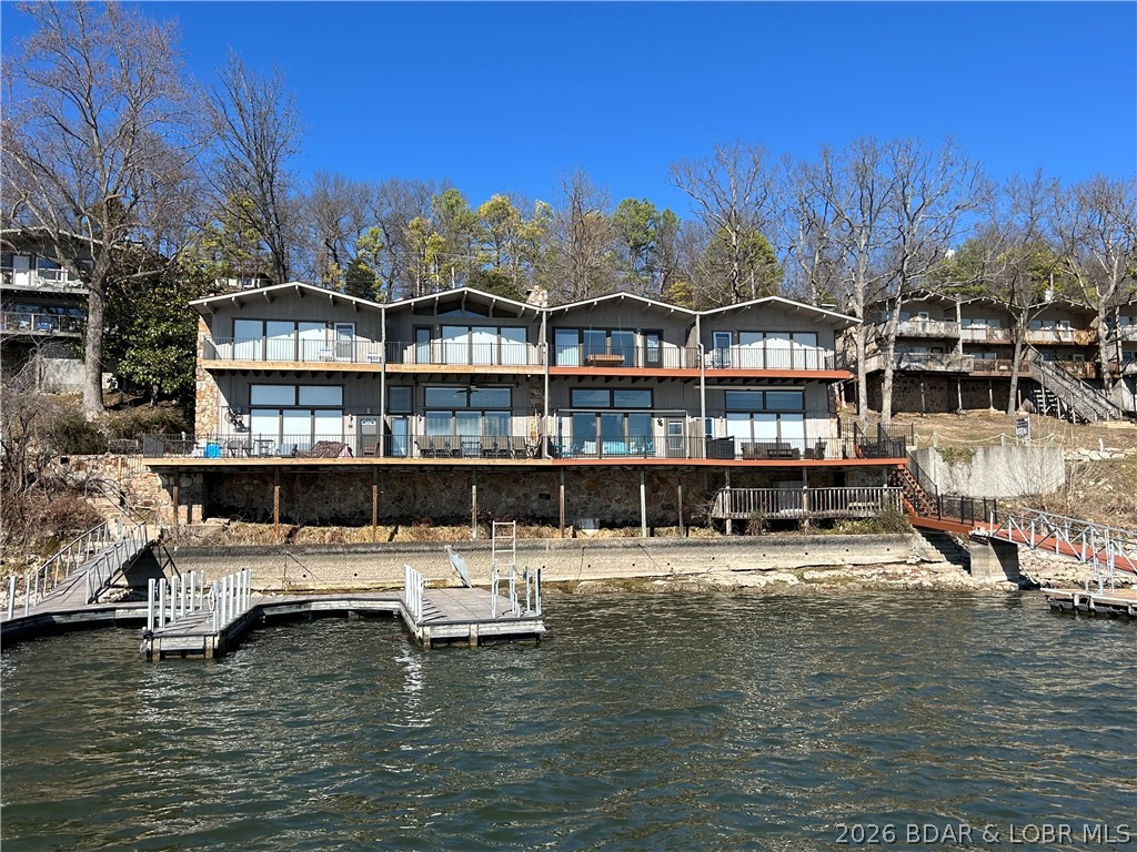 Lake living at its best in Osage Beach, this 3 bedroom 3 bath 2-story townhome style condo is located at the 26.5 MM on the main channel and offers incredible sunset views!

Featuring walls of windows in both the living room and the primary suite, this home is filled with natural light and showcases the lake from multiple views. This unique layout includes a spacious living area with a fireplace, deck (new decking and rails), and a private upper deck off the primary bedroom.

Fully renovated with numerous upgrades including kitchen, HVAC, plumbing, tankless water heater, and a master bathroom addition.

Dock Access:
>Deckside day-dock for convenient loading and unloading 
-Also available - 
>Boat slip (up to 40') with lift in adjacent protected cove just off the main channel
>Personal watercraft slip with lift in same cove 

Ideally located in the heart of Osage Beach close to dining, shopping, and entertainment

Near Margaritaville Lakeside Resort off Hwy 54 and Hwy KK