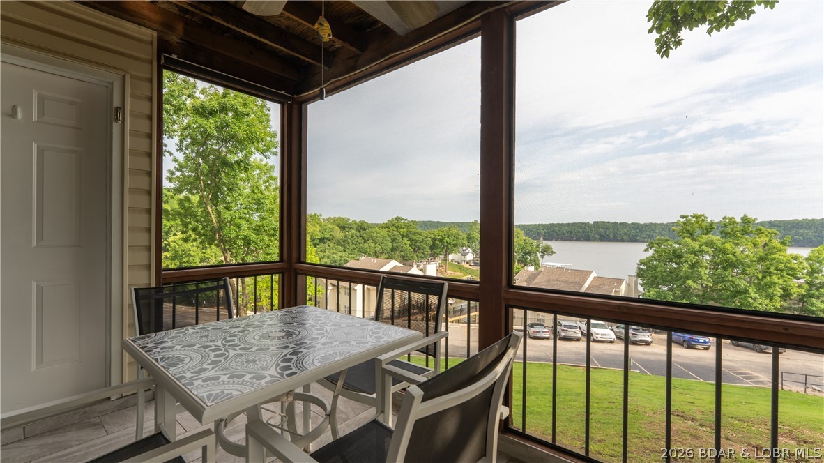 Start your mornings with coffee on the screened deck and end your evenings watching the sunset over the main channel. With breathtaking lake views, this beautifully updated 2 bedroom, 2 bath condo was made for easy lake living. Sold furnished and turnkey as shown, it’s move-in ready for summer. The kitchen features 42” soft-close cabinets, exotic granite countertops, updated lighting, and newer appliances, while both bathrooms have been refreshed with granite-topped vanities and updated fixtures. The primary suite offers triple-pane windows framing incredible lake views, plus a walk-in onyx shower and supplemental heat in the bath for year-round comfort. Located at the 22MM in the heart of Osage Beach, Breakwater Bay offers a lakeside pool, basketball court, playground, clubhouse and extensive recent HOA upgrades including Trex walkways, updated parking areas, retaining walls, staircases, and new docks. Just minutes away from Redhead's, Margaritaville Resort, shopping, dining and entertainment. Perfect as a personal getaway, full-time residence or rental investment at the lake. Watch the video and schedule a private showing today! 6,500# Econo Boat Lift, Captains Choice for extra $