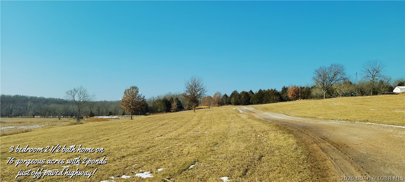 3 bdrm 2 1/2 bath home on 76 gorgeous acres with 2 ponds! This lovely home is located on a paved road in the Cole Camp, MO school district. Mostly fenced with approximately 30 acres of row crop, the remaining in open pasture & trees. Plenty of room to run cattle or horses. Home boasts of an open floorplan for entertaining. Spacious living room & dining area, island in the kitchen &appliances are included. Large master bedroom includes full bath with walk in shower & tub. Main floor laundry, mudroom & 1/2 bath. Upper level has an open loft for TV or toy area. Two large bedrooms, office, full bath & 2 storage rooms. Massive 30x40 attached garage with wood burning stove for those chilly nights. Carport with storage building attached, 23x32 lean-to. Wonderful above ground pool with deck & stunning views from every direction. Property includes large creek that joins Cole Camp Creek. Property goes up over the ridge with fantastic hunting ground! Owner has multiple deer stands on the property. Three phase electric is being brought into the area. Como Electric provides high speed fiber optics. You won't want to leave home, this beautiful property has everything you'll ever need!