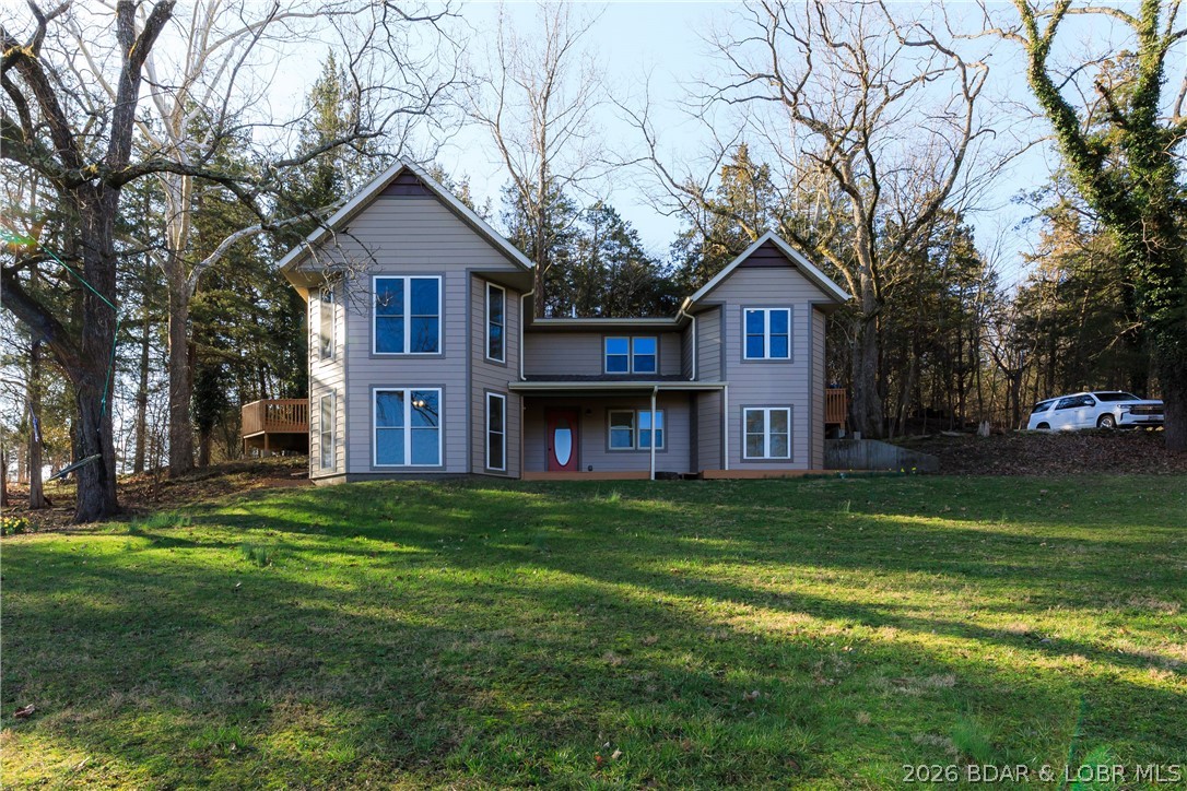 Back on the market at no fault of the Seller! Opportunities like this are hard to find! This recently updated 4 bed, 3 bath home sits on 18 acres in a prime location next to Lake Valley Golf Course and just 6 minutes from the Camdenton Square. With 1,255 feet of highway frontage, the possibilities here are endless—whether you're looking for a private retreat, hobby farm, or an investment opportunity. The home features granite countertops, double ovens, a gas range, & modern updates throughout, offering both comfort and style. Step outside to enjoy the in-ground pool, perfect for relaxing after a day on the lake or the golf course. The property offers a beautiful mix of open pasture & wooded acreage, along with a pond, making it ideal for animals, recreation, or future development.
A detached 2-car garage provides extra storage for vehicles, lake toys, or equipment. With lake access and a nearby boat ramp, you’re only minutes from enjoying the Lake of the Ozarks lifestyle.