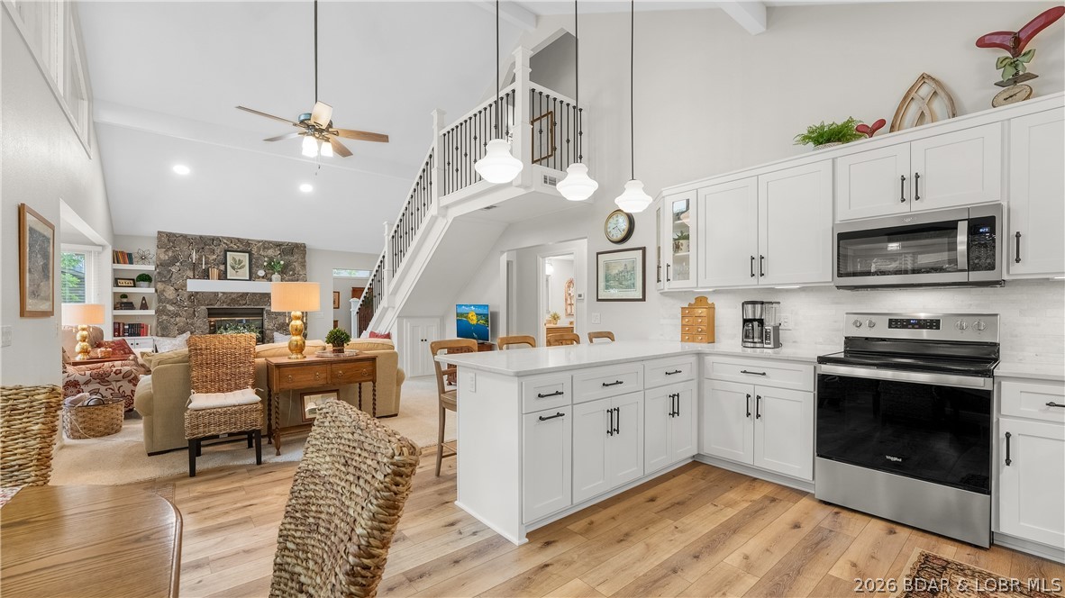 Professionally remodeled to perfection, this gorgeous Lake Ozark home delivers the ultimate lake lifestyle. Nestled on a private road just off Horseshoe Bend, the property features a spacious, open floor plan, a stunning chef’s kitchen, and oversized bedrooms. Step outside to enjoy intimate, shaded outdoor living in a deep-water cove at the 8.5mm—complete with an exceptionally gentle lot, a 2-car attached garage, and abundant parking. High-ticket updates include a new roof, dual HVAC, water heater, and kitchen appliances, concrete driveway, exterior painted 2024, too many upgrades to list.  Be sure to check out the feature sheet attached. Incredible location minutes from fine dining and entertainment. Don't drag your feet on this luxurious home - it won't last long! Call your realtor today!
