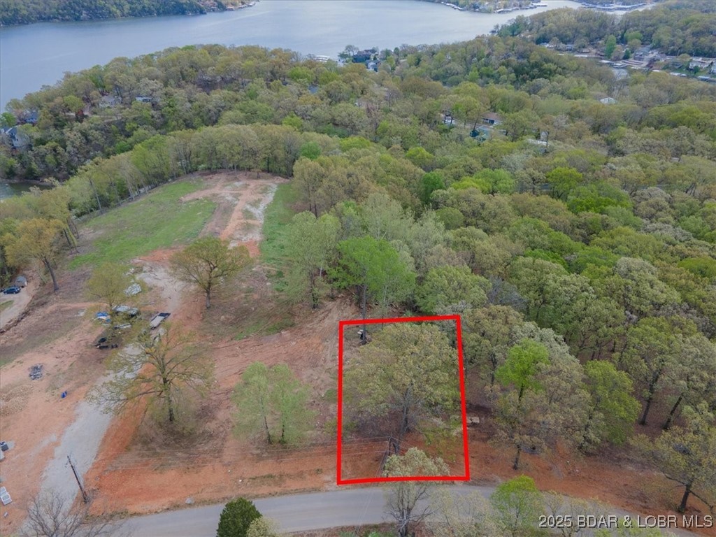 Nestled in brand-new subdivision, this gentle 0.39-acre lot offers a serene and tranquil setting, perfectly situated between Camdenton and Osage Beach. Enjoy the convenience of being centrally located, with easy access to the best shopping, dining, and recreational activities these vibrant communities have to offer. Providing the ideal foundation for your dream home, whether you're looking to build a family residence or a vacation getaway. Embrace the peaceful surroundings and create your own haven in this prime location.