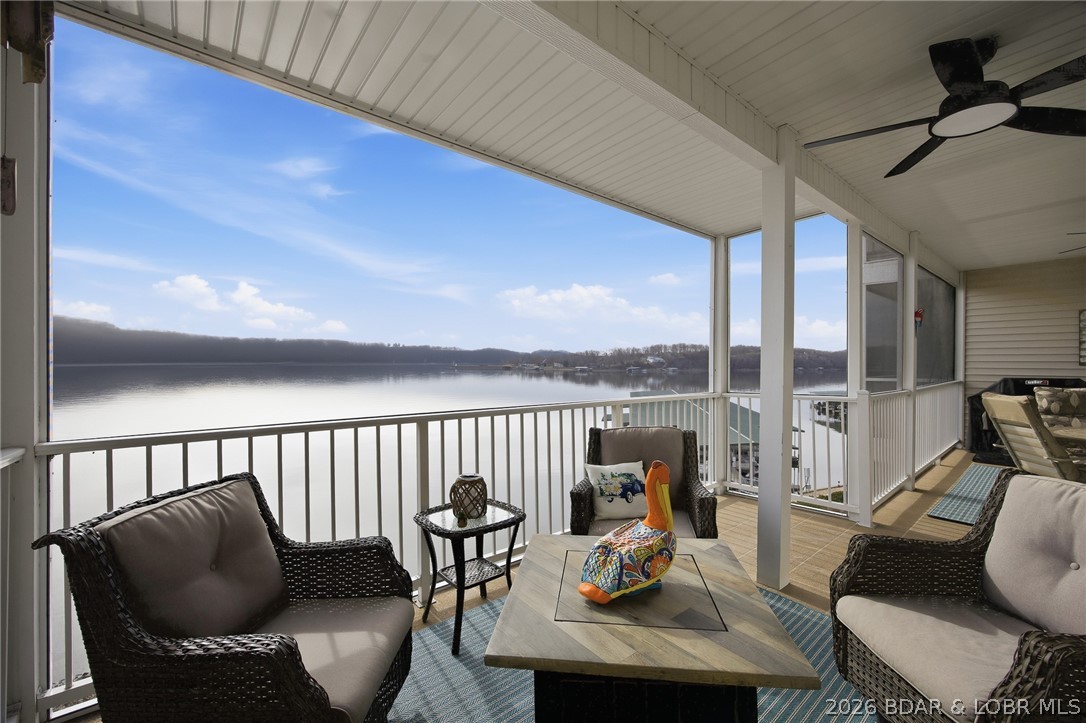 This highly desirable residence is situated at the picturesque 38½ Mile Marker within the renowned Windgate on the Lake Condominiums. Located in Building 140, this walk-in, end-unit offers enhanced privacy, abundant natural light, and effortless access with no stairs from the parking area.

This truly turnkey condo has been comprehensively updated and is move-in ready. Recent upgrades include a brand-new HVAC system (2023), new luxury vinyl flooring throughout, a beautifully remodeled primary bathroom, new kitchen cabinet doors, and a newly installed water softener (2025).

The spacious open floor plan features generous living and dining areas, large bedrooms, oversized bathrooms, and expansive glass windows and doors that fill the home with natural light. The large screened-in deck provides the perfect space to relax and enjoy the peaceful lake setting.

For boating enthusiasts, this property includes a private garage and a 12x32 boat slip equipped with a 6,000-pound lift. Residents also enjoy access to two community swimming pools, and elevator service to the docks and pools. This beautifully updated condo is move-in ready and waiting for its next owner.