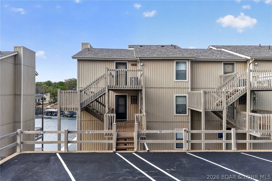 Welcome to Indian Pointe! Located in the heart of Osage Beach at the 17MM, this main-floor, fully furnished unit is clean, move-in ready, and perfect for summer fun! Reserved parking is right outside, with just a few steps to your front door. 10x28 boat slip with hoist comes with this unit (additional qtly fee $150). Inside, enjoy an open floor plan with updated appliances, cozy fireplace, and a spacious breakfast bar. The primary suite features incredible lake views, a walk-in closet, and a full bath with room for your oversized bed. The second bedroom offers easy access to the additional full bath & extra storage. Relax on your covered deck overlooking the main channel, or take advantage of the community's amazing amenities: Clubhouse, 3 pools, Tennis/pickle-ball courts & a community that allows rentals! Whether you’re looking for a weekend retreat, a full-time home, and/or additional income, this one checks all the boxes! Location: Corner Location, End Unit, Ground Level