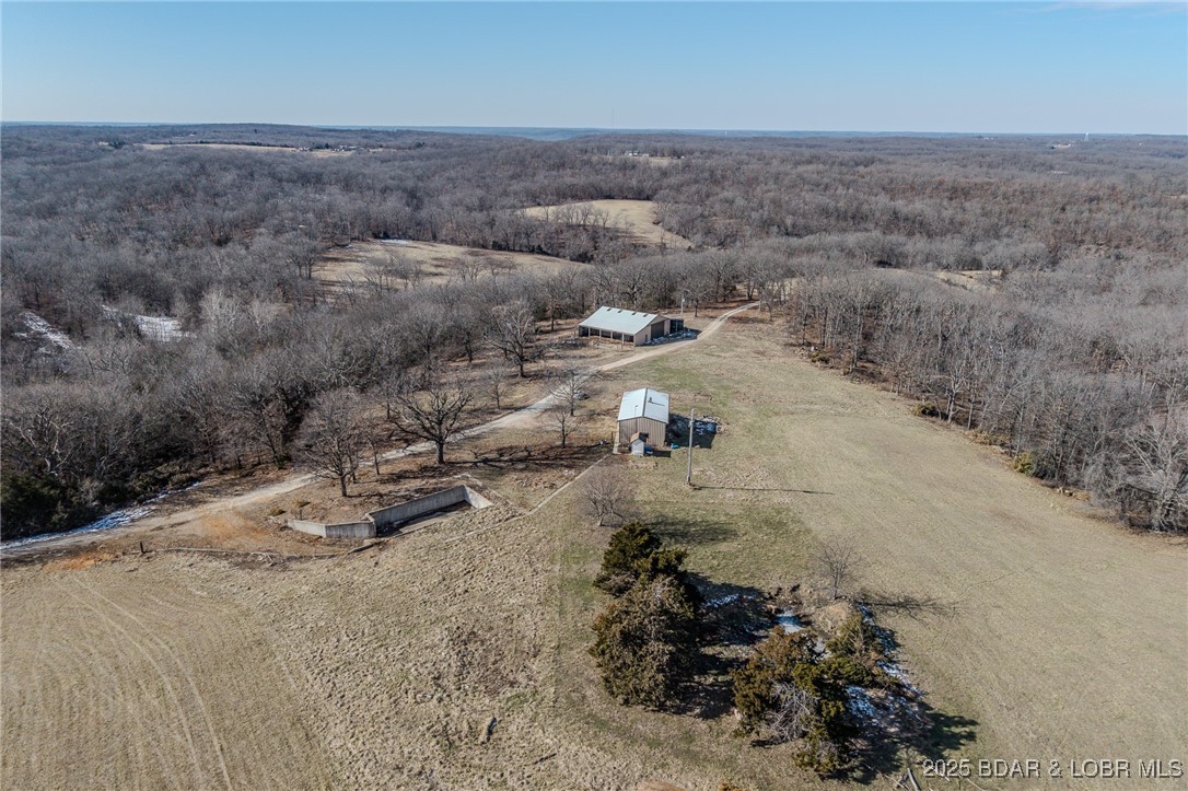 This expansive 233.45-acre property offers a unique combination of natural beauty, versatility, and privacy, making it perfect for a variety of uses. This property boasts a wealth of key features, including two wells, two natural springs, and two ponds, providing ample water for farming or livestock. A spacious 40x60 concrete-floor barn with lean-tos on each side offers great storage or livestock shelter, while a small shop provides additional workspace. The property is fully equipped with roads throughout, ensuring easy access to every corner, and is situated privately at the end of the road. It is also surveyed for subdivision, offering potential for future development. Whether you're looking to expand your agricultural operation, create a private retreat, or develop a subdivision, this property offers endless possibilities. With its mix of natural features and practical infrastructure, it’s an ideal spot for both work and recreation.

Don't miss this rare opportunity to own a versatile, private, and accessible property just minutes from town. Call today to schedule a showing!