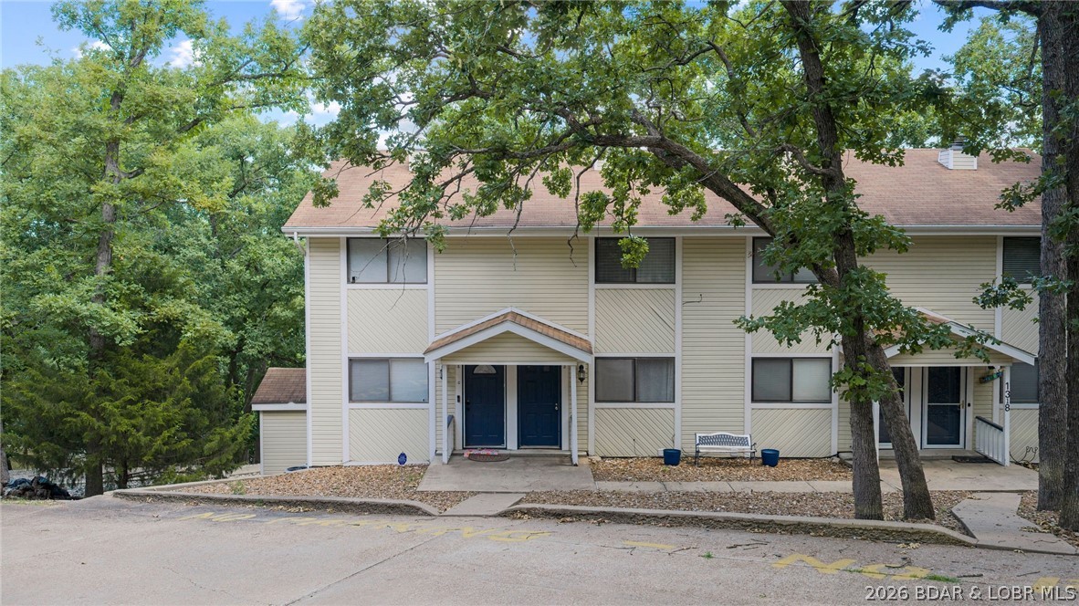 Welcome to 1318 Evergreen Ln #3, in the heart of Osage Beach, Missouri!  2 bedroom, 2.5-bath walk in unit . Cozy up by the full electric fireplace on cool evenings, or take advantage of the spacious deck and lower-level walkout covered patio—perfect for grilling, entertaining, or simply soaking in the spectacular lake scenery. Just a short stroll brings you to the community dock offering a swim platform, and you'll love having your very own covered 10x30 boat slip—ready for endless days on the water. Tucked in a prime location, this unit is only minutes away from some of the Lake’s most popular restaurants, shopping, and entertainment, giving you easy access to the best Osage Beach has to offer. Priced significantly below appraisal values, and a great long term rental investment. Don’t miss your chance to own a piece of paradise—call today to schedule your private tour!