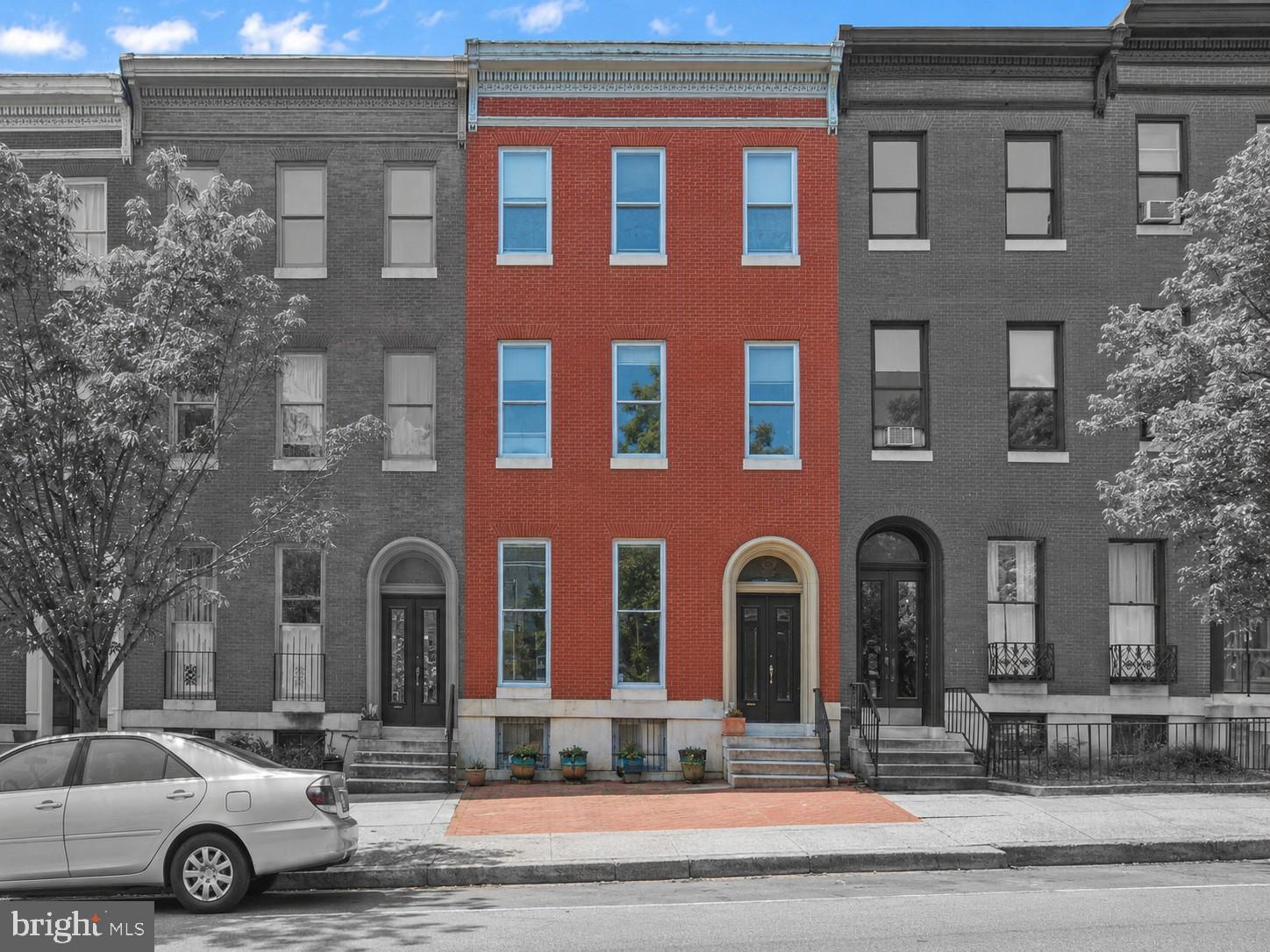 1728 Bolton Street is a turnkey Bolton Hill triplex with off-street parking, in-unit laundry and located in one of Baltimore’s prettiest and most established rental neighborhoods. 1728 is near MICA, Light Rail, Penn Station, I-83, MLK Boulevard, downtown Baltimore, and the Reservoir Square redevelopment.

The property has 2 two-bedroom, two-bath apartments and 1 one-bedroom, one-bath apartment. The apartments feature large living areas, tall ceilings, good natural light, and decorative fireplace mantels, giving tenants the space and character that help older Bolton Hill buildings stand out. Kitchens include wood cabinetry, dishwashers, and gas ranges, while bathrooms include modern vanities and ceramic tile flooring. These are durable, tenant-friendly finishes that can stand up to regular rental use.
Laundry is already in place for all three apartments, which is a meaningful tenant amenity in a city rental property. Units 1 and 2 each have a full-size washer and dryer in the basement. Unit 3 has a stacked washer and dryer in the apartment.

Tenants currently pay their in-unit gas and electric, and the washers and dryers are connected to each tenant’s individual electric panel rather than public service electric. This keeps a desirable tenant amenity from becoming a public service expense. A new owner may be able to further improve cash flow by billing tenants back for their share of the water bill and public service electric.

With three licensed apartments, off-street parking, tenant-paid gas and electric, laundry, and 1728 Bolton Street offers a stable long-term hold in prestigious Bolton Hill.