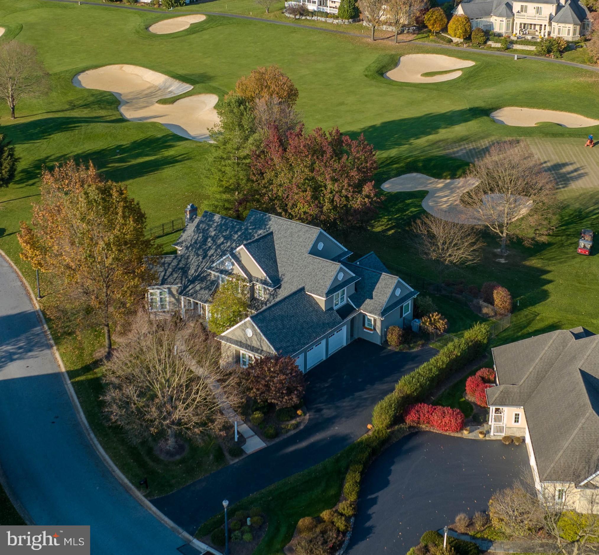 This four-bedroom house located in the Bent Creek community offers beautiful golf course views and is adorned with gorgeous crown molding, hardwood floors, and granite countertops. The spacious rooms and large windows allow for plenty of natural light to fill the home. The family room opens up to the kitchen and features high ceilings and a gas fireplace, making it the perfect gathering space. The primary bedroom on the first floor includes two walk-in closets and a luxurious bathroom with double sinks, a glass shower, and a soaking tub. Upstairs, you will find three additional bedrooms and a sitting area overlooking the living room. The lower level offers a large recreation room, an exercise room, ample storage, and a kitchenette with a full-size refrigerator and island. Parking is plentiful with a 3-car garage and driveway space. The Bent Creek community offers golf courses, tennis court, and clubhouse where you can enjoy lunch. The community is also gated and offers a peaceful walk through its gorgeous surroundings. This unique home is conveniently located near Lititz, The Shoppes at Belmont, Park City Mall, Lancaster Airport, local dining, shops, and entertainment. Don’t miss out on the opportunity to experience luxury living in the Bent Creek community schedule a showing today!