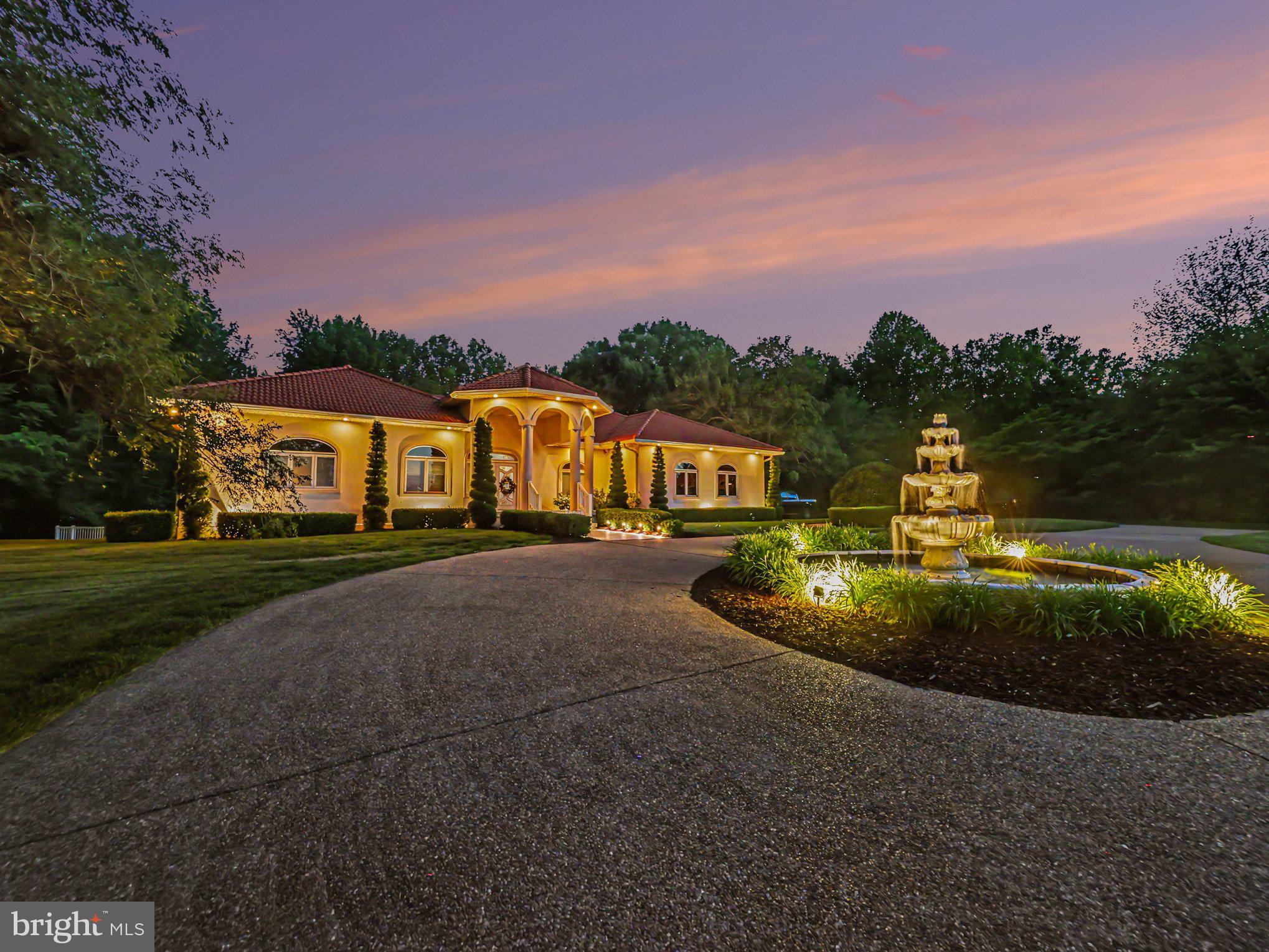 Country club living, wide-open acreage, and only 3 miles from Downtown Fredericksburg! This Mediterranean-style estate makes an unforgettable first impression with a grand circular drive, tiered fountain, columned portico, and a signature Brava tile roof (2023). Inside you’ll find soaring ceilings with Level 5 drywall, engineered hardwood floors, and a light-filled layout. 

The chef’s kitchen is built around a Thermador 48” double-oven gas range, Sub-Zero refrigeration, quartz countertops, and custom cabinetry, all finished with designer tile and statement pendant lighting. A sunroom opens to a glass-lined patio perfect for morning coffee or sunset drinks. Two primary suites anchor the main level, including an owner’s retreat featuring an 11×5 ft rainfall shower, dual vanities, and dual closets.

Take the private elevator to a lower level that rivals the finest private clubs complete with a tiered leather cinema, glass-enclosed wine room, 18-seat curved bar, billiards, private gym, and a third full primary suite. Outside, the resort-style saltwater pool features a zero-entry design, mosaic spa, 5-seat swim-up bar, in-water lounge chairs, cascading water features, and 7 Pentair IntelliBrite LED lights. Every room flows with sound through a Control4 whole-home audio system. This is elevated living, inside and out. Schedule your tour today!