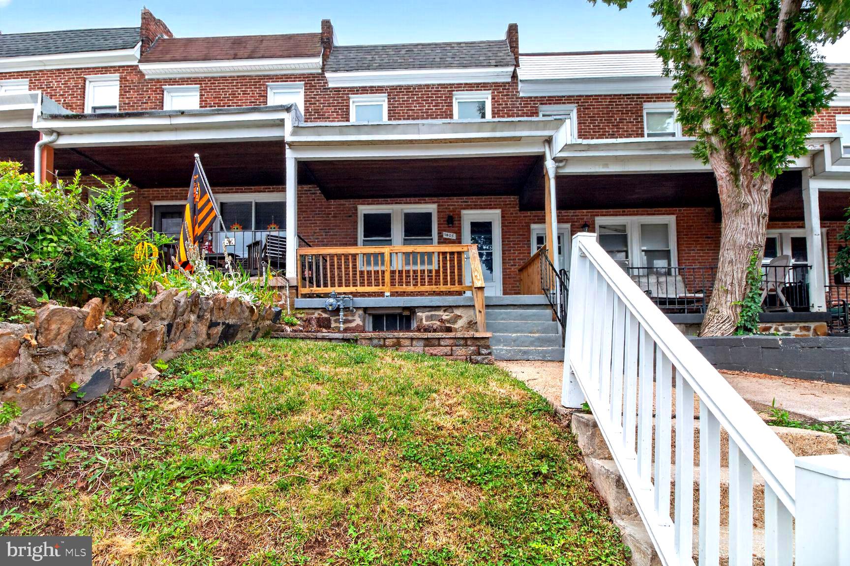 Welcome to 1405 W 37th Street, a charming 3-level interior brick townhouse located in the heart of Baltimore’s highly sought-after Hampden neighborhood. Renovated in 2022, this beautifully updated home blends classic Baltimore rowhome character with modern finishes throughout. Step inside to find luxury LVP flooring, dual-pane double-hung windows, and a bright, functional layout designed for comfortable everyday living.
The main level offers spacious living and dining areas with plenty of natural light, leading into a stylish renovated kitchen featuring updated cabinetry, granite countertops, tile backsplash, stainless steel appliances, and access toward the rear of the home. Upstairs, you’ll find 3 bedrooms and 1 full bathroom, offering flexible space for bedrooms, a home office, or guest accommodations. The partially finished basement adds additional usable space, perfect for storage, recreation, a home gym, or future customization.
Enjoy outdoor living with a large front porch, a rear covered patio, and the charm of an adorable one-way, non-through street that offers a quieter neighborhood feel. Street parking is available.
Located in vibrant Hampden, this home is just minutes from everything that makes the neighborhood special. Enjoy a short walk to the famous Avenue, The Rotunda, Roosevelt Park and Pool, the skatepark, Jones Falls Trail, local shops, and more than a dozen nearby restaurants and bars. You’ll also be close to the beloved 34th Street Christmas light celebration. Commuters will love the easy access to I-83 and the Woodberry Light Rail station.
With its updates, location, neighborhood charm, and convenience, 1405 W 37th Street has all the right reasons to be your next home.