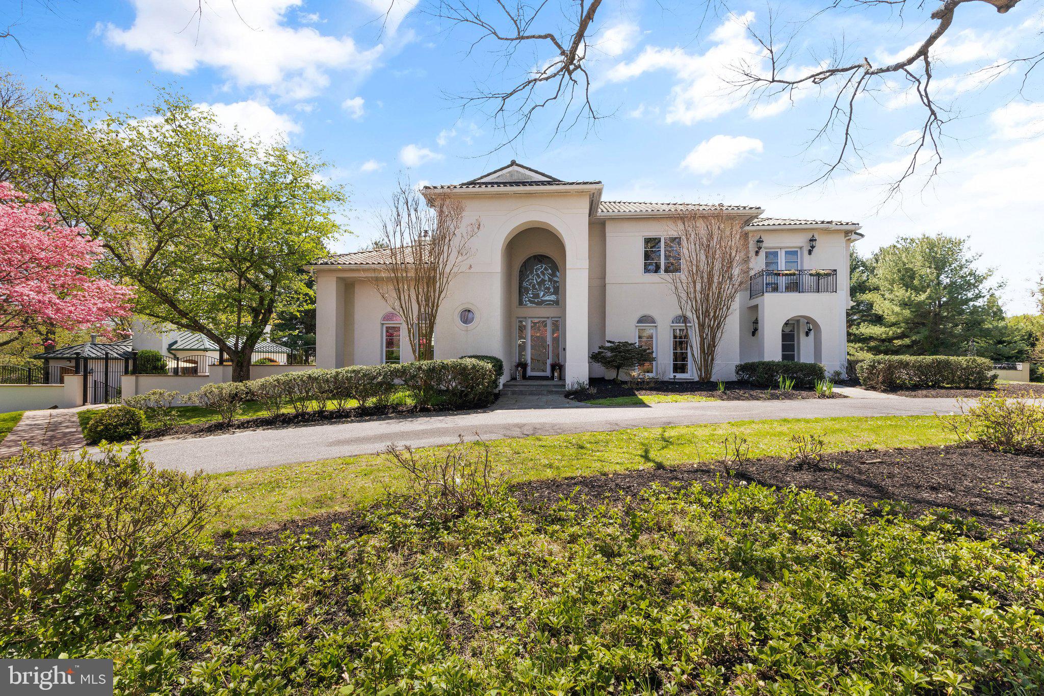 This luxury residence is custom-designed with a Mediterranean influence. There is no end to the flexibility and lifestyle options possible with a total over 11,000 finished square feet. A pair of custom, etched glass front doors open into a grand Foyer showcasing the custom European curved glass and granite staircase. Inside, the perfected main level living spaces include living and dining formals, family room, private work-at-home study and breakfast room, that all radiate about the large central gourmet kitchen on one side. Kitchen features Thermador wall ovens and cooktop, Sub-Zero refrigerator, Murano crystal back splash, custom shelving and walk in pantry. Entertain, gather and celebrate in the lower level outfitted with media room, game area, an exercise area, full bath, and bar. Upstairs, a dramatic hall overlooking the two story foyer leads to the private Primary suite wing with a private balcony. The primary bath features a double sided fireplace, oversized jetted tub, flanked by two vanities, a steam shower, heated floors and balcony. Two primary walk in closets with two secret doors leading to other closets. The upper level is completed by three additional en-suite bedrooms with Jack and Jill bath, full bath and built. Ins. Inside, entertain formally in spacious living and dining rooms, and retreat after to a wrap-around wet bar.
There are also endless entertainment options that are possible for indoor and outdoor venues alike. A private paver patio is accessible from the kitchen and family room. This leads to a basketball court and magnificent pool house with full bath, indoor grill, Viking appliances and lounge area. 
There is simply no detail left out and nothing to compare with this spectacular entertainer delight that is sure to invite gatherings large and small. Come home to luxury, privacy and the perfect space for every occasion! Custom designer touches throughout! Call today for your private tour!