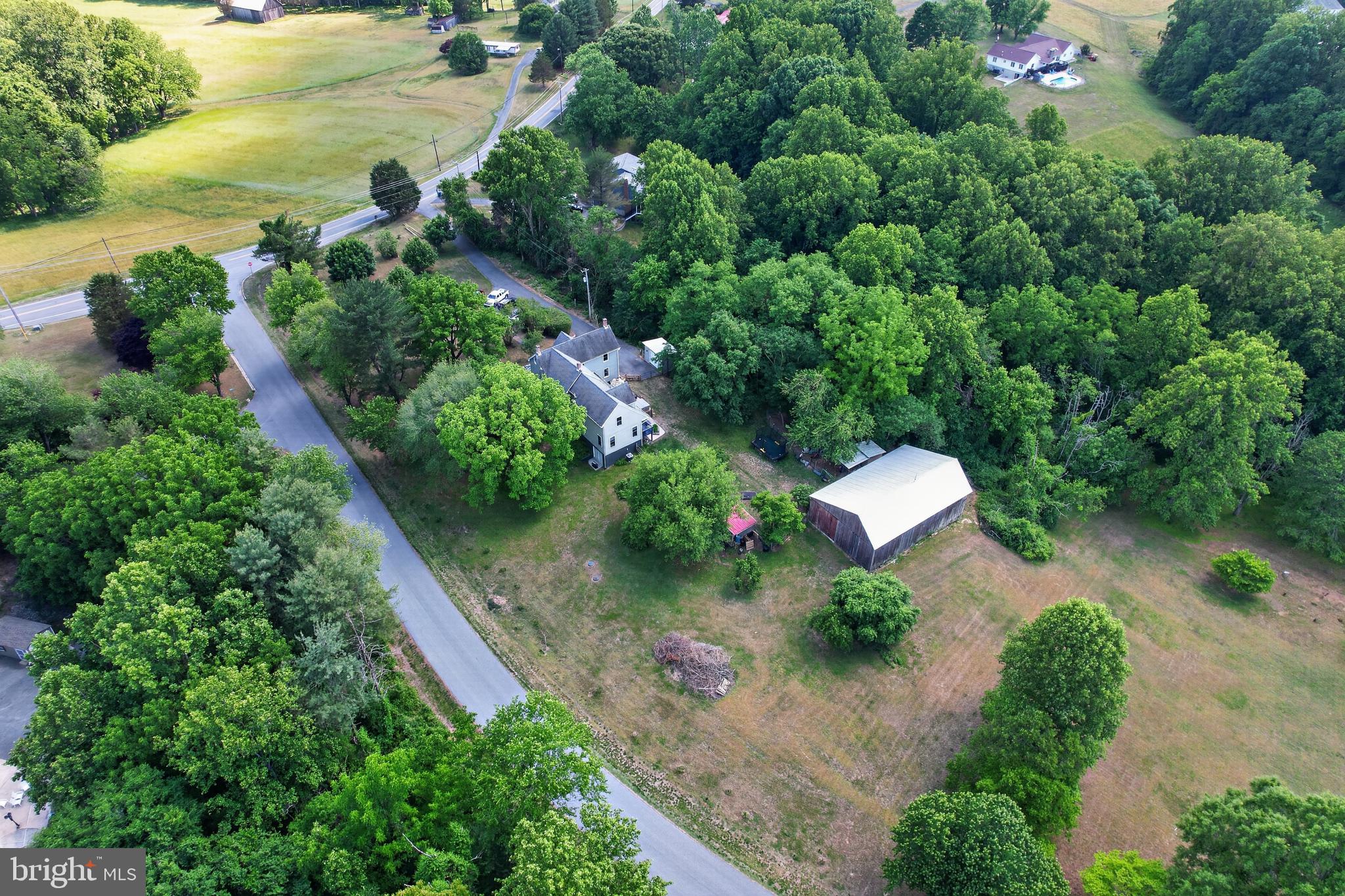 Discover the perfect blend of early 20th-century character and modern functionality in this stunning 1920s farmhouse at 2715 Lower Marlboro Rd. Located in the historic heart of Calvert County, this property is a "true gem" for those seeking a connection to Maryland’s rich historical past without sacrificing contemporary comforts.
The Residence:
Built in 1920, this 4-bedroom, 3-bathroom home has been lovingly maintained to preserve its historic soul:
Timeless Finishes: Original hardwood floors flow through every room, offering a warmth and durability rarely found in modern builds.
Spacious Living: With four generous bedrooms and three full baths, the home provides a comfortable layout for family and guests alike.
Finished Basement: Adding a rare layer of versatility to a historic home, the finished basement is ideal for a cozy den, home office, or climate-controlled hobby space.
3 Acres of Modern Homesteading
The property extends over 3 acres of lush, usable land, designed for both productivity and play:
The Tobacco Barn: A magnificent piece of local history, this massive barn is a hobbyist's dream, featuring a mechanic’s pit and a 100-amp metal sub-panel for heavy-duty projects.
Flourishing Orchard: Enjoy a literal "farm-to-table" lifestyle with 100 newly planted trees. The grounds have  established organic apple, pear, mulberry, and plum trees, alongside established patches of blueberries, blackberries, and wild raspberries. 
Country Amenities: The estate includes a dedicated chicken coop for fresh eggs and a custom tree fort that adds a touch of whimsy to the landscape. Chicken can convey if buyer so chooses. 
NEW SEPTIC INSTALLATION SCHEDULED FOR JULY
The seller will consider offering their 2.25% VA assumable loan to eligible VA buyers. Ask your Realtor for more information.