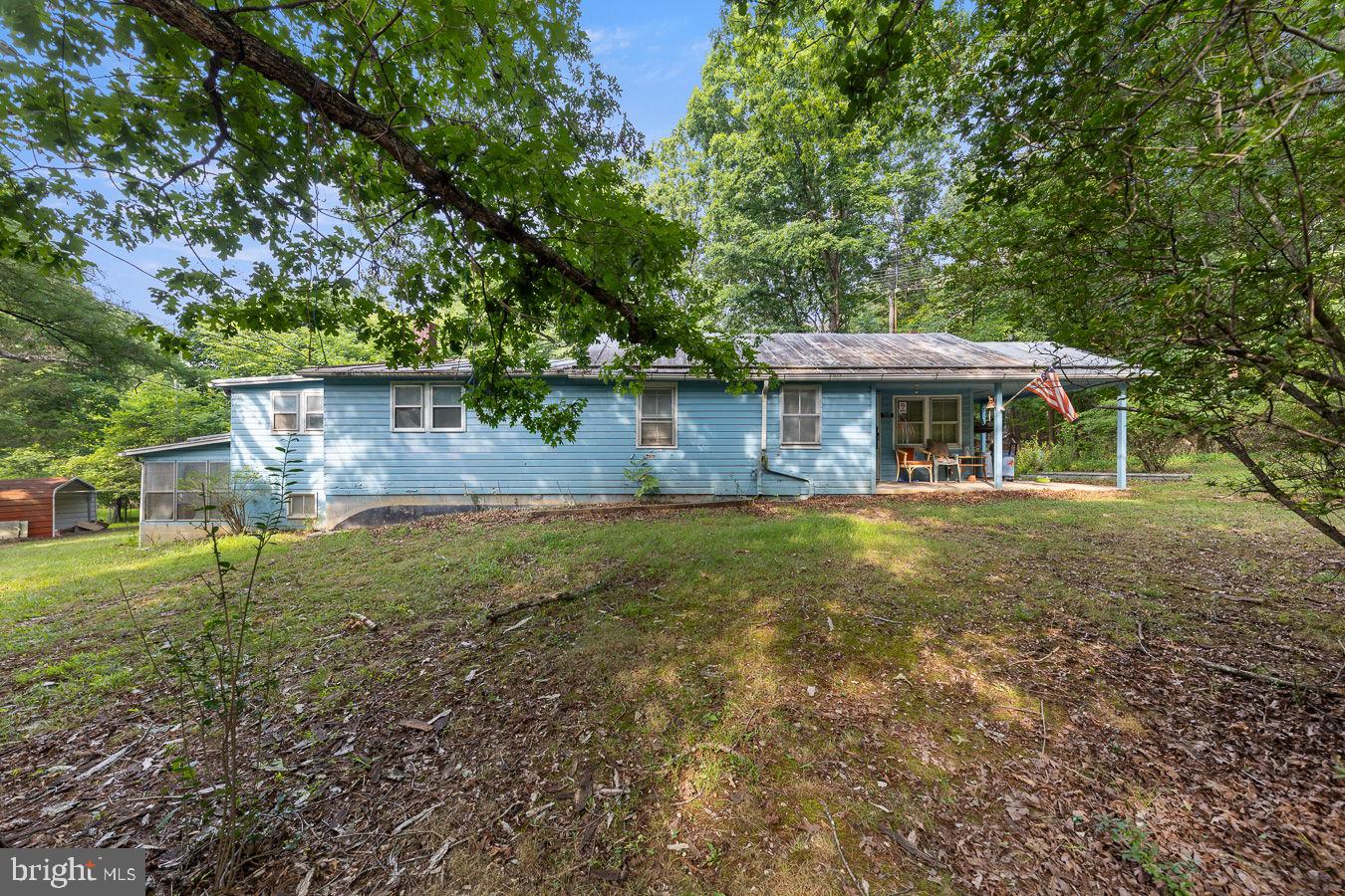 Coming Soon! - Ranch Fixer Upper with 2 lots totaling 4.3 acres near Bryce Resort! This property is located near Supinlick Ridge Road and next to Lots in Sky Bryce.  3 Bedrooms 1 bath and a partial basement with several outbuildings. Turn this home into a Short Term Rental, Vacation Spot, Full Time Residence. Loads of possibilities!