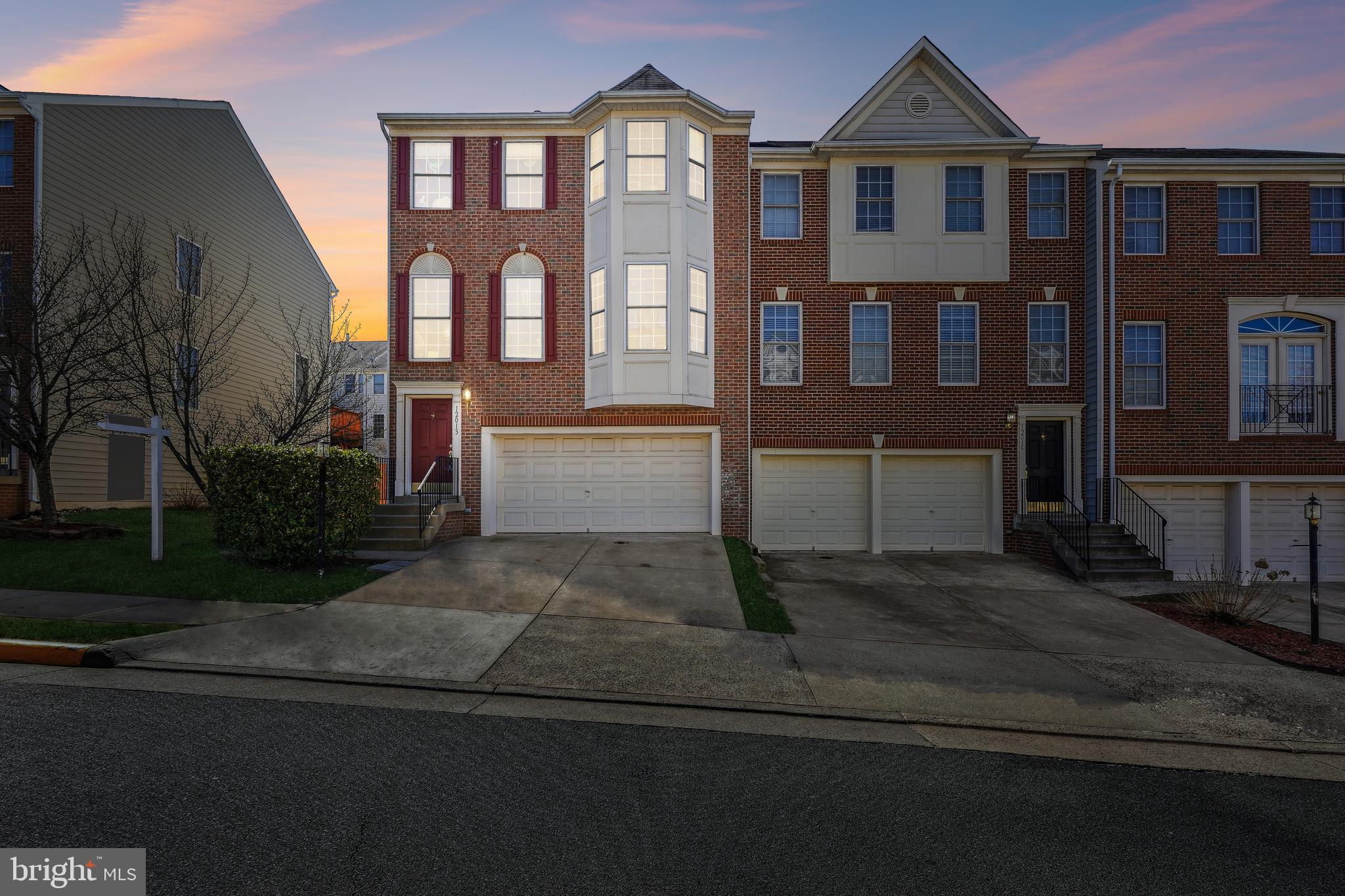 Opportunity is knocking to own a Beautiful 3 level Brick front, End Unit,  2 car garage home with access to the lower level with a walk-out; Lower level also offers a gas fireplace half bath, and space to gather. The Providence Model boasts all its Colonial Style with formal living, and dining showing off the elegant columns, and a beautiful granite  counter in the full service kitchen with space to design your meals and space to dine, with a sliding glass door from the dining area and a Beautiful sun filled sitting area. A Large Pantry for your storage needs.   A half bath on the main level also!   Community has additional parking for your guests in the community.     The primary Bedroom is spacious and offers his & hers closets; The well equipped Primary bath offers a large soaking tub, with double vanity and separate shower all  for your relaxation.  Are you looking for a community with amenities, then look no further! Pool, play ground and more! Close to Shopping, 3.8 miles to George Mason Science Campus; access to major roadways; access to major shopping approximately 1-2miles.