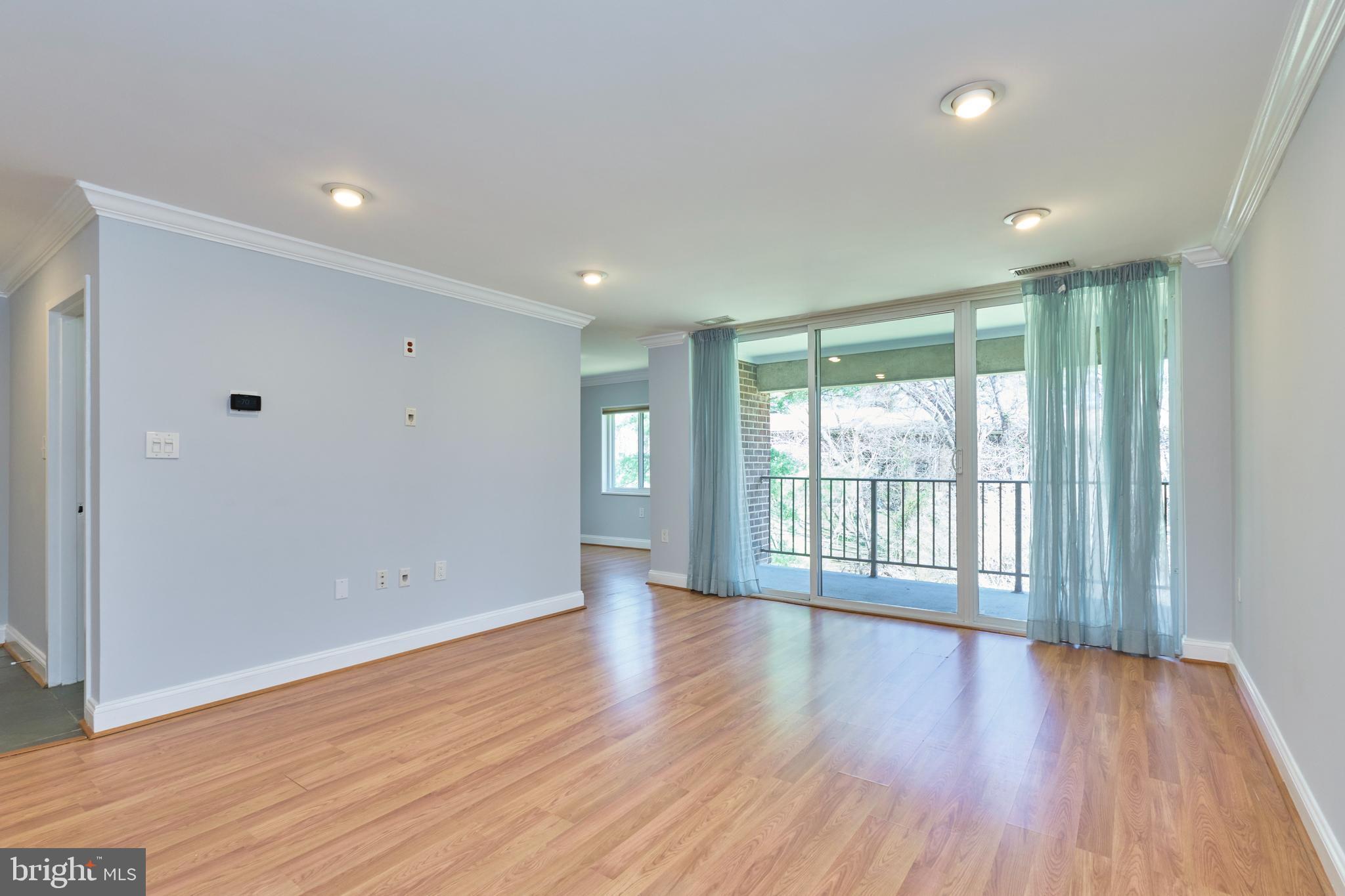 Stunning, fully updated condo in Reston! Fantastic location -  within walking distance to beautiful Lake Anne, Silver line metro and the best of Reston Town center! This 2 bedroom, 2 bathroom condo is bright, spacious and ready to move in! Enjoy the panoramic view of the common area from the living room, dining room and the large deck! The kitchen is fully updated with brand new glass tile backsplash, granite countertops, upgraded cabinetry, gas cooking, stainless steel appliances, ceramic tiled floors and more! There is a separate dining room in addition to a large living room.  The primary bedroom offers a walk in closet with built in shelving and an en-suite full bathroom. The second bedroom also offers a large closet with closet organizers. There is a second full bathroom. Both bathrooms are updated. The entire condo is freshly painted an appealing neutral color. Laminate flooring through out the unit.  Fan/lights in both bedrooms. Recessed lighting, crown molding are some of the notable features of this condo. Washer and dryer are in unit. The condo fees covers all utilities - electric, gas, trash, snow removal and water!! The condo association maintains the entire central heating and cooling system. They also do regular filter maintenance! The windows and sliding glass door replacement is also part of the condo fees and they were replaced a few years back. Other notable benefits provided by the condo association are an on premise maintenance crew for any emergency maintenance and also regular pest control and trash service, building master insurance, general common area maintenance, roof maintenance and more! Avail Reston Association amenities such as the many pools, tennis courts, trails, playgrounds, multiple lakes and so much more! Silver metro is about a couple miles away. Reston town center is also close by. Major commuter routes including 267, Rt 7 and more! Close proximity to major companies along the tech corridor! Come see this gorgeous unit today!! Make your move!!