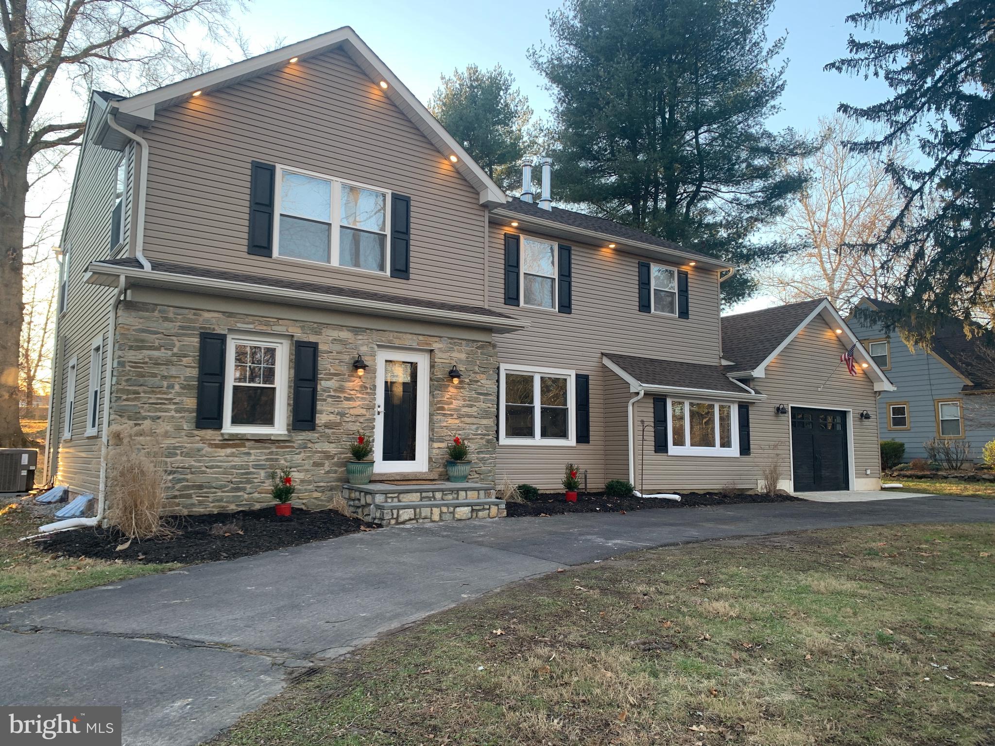 Completely Renovated Yardley Gem!
 
Welcome to your “almost new” home at 205 Taylorsville Road nestled in beautiful,
convenient Yardley PA.  The real stone and siding exterior with circular drive make for quite the
dramatic entrance. to this remarkable home featuring 5 spacious bedrooms and 3 full
baths.
This beautiful home has been completely renovated from top to bottom. From the
seamless new second story added in 2021 down to the large finished lower level, it is
obvious that every detail had been thoughtfully considered in the construction. 
Beautiful smoke grey hardwood floors and upgraded arched paneled interior doors are
featured throughout the first floor. Beyond the spacious living room with new windows
and recessed lighting is a large first floor bedroom and new full bath with custom tile
and cabinetry.
The heart of the home is the designer kitchen boasting soft close Shaker cabinetry,
beautiful black granite countertops, custom island, Brand New LG ThinQ stainless steel appliances, French door refrigerator, Stunning blue enamel interior LG oven,  white shiplap ceiling, subway tile backsplash,  matte black cabinet hardware kitchen faucet.and new hardwood flooring. Two large windows offer a view to the expansive backyard. The kitchen flows seamlessly into the dining area, making this the perfect home for entertaining. Adjacent to the kitchen is the generous family room featuring a real stone surround and brand new firebox insert. Specialty sliding doors lead to the large stamped concrete patio and backyard.  
 
The second floor offers a generous primary bedroom with en suite bath featuring
custom tile, handsome dark cabinetry, bead-board and custom trim. The main bedroom
includes a welcoming sitting area and a huge walk-in closet. 
The second floor includes three additional roomy bedrooms complete with recessed
lighting, large closets, and ceiling fans.
The full hall bathroom is gorgeous featuring “wood look” grey glazed porcelain tiles and
soft light grey cabinetry. For seamless design, the entire second floor showcases luxury
vinyl plank flooring. 
  
The huge finished lower-level features luxury vinyl flooring.  Exterior door exits to new stairs leading to the expansive backyard that is ideal for entertaining.
Oversized one car finished garage with garage door opener.
Award winning Pennsbury school district. Perfectly located for easy commutes to Philadelphia, NJ and NY.  Walking distance to Yardley’s quaint shopping area, restaurants, ice-cream and brewery.  Or enjoy an idyllic stroll or bike ride on Yardley’s picturesque canal.  Enjoy all that Beautiful Yardley in  Bucks County has to offer!This home is an absolute gem for those seeking a premium, move-in residence in a highly desirable location.  Some rooms have been virtually staged. .Make your appointment today!