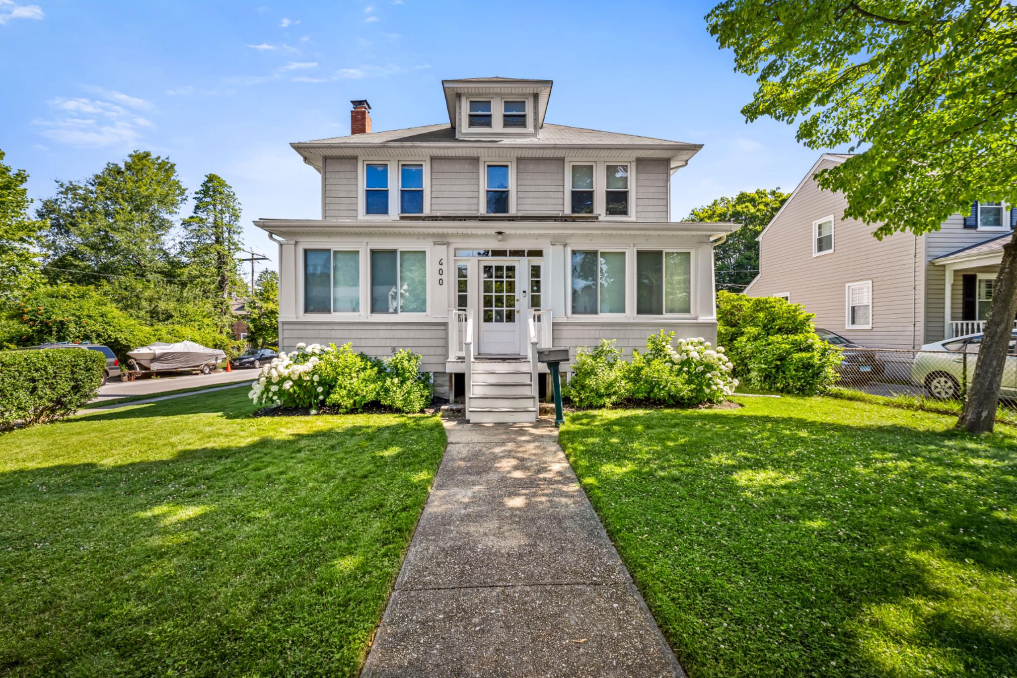 This charming Colonial home, built in 1926, offers a perfect blend of classic elegance and modern comfort.  The house has 4 spacious bedrooms and 2 full bathrooms, including a newly renovated bathroom offering a spa-like experience.  The location is prime, as it sits on a corner lot in the heart of the Anneslie neighborhood.***As you walk in, you are greeted with a refinished sunporch that provides a peaceful setting to drink your morning coffee, while a light breeze and the sun filters through the array of south facing windows.  Step inside to discover beautiful, original hardwood floors that flow throughout, complemented by a traditional floor plan that includes a formal dining room and a living room featuring a newly refinished wood-burning fireplace-ideal for creating warm memories.  The living area perfectly flows into the kitchen, boasting an island and modern appliances, including a gas range and dishwasher, making meal prep an enjoyable experience.***The second floor consists of 4 large bedrooms, a rarity for this neighborhood, and enough closet space to surprise. A full bathroom is conveniently located just outside the bedrooms. If room to expand is on your horizon, a walk-up attic presents a great opportunity to create a private suite with ample space for a bedroom & bath.***Out back is a nicely designed composite deck that is the ideal space for outdoor gatherings under the shade of a Japanese maple.  A well-maintained yard, with a private driveway that offers the desired side-by-side parking option.  The driveway leads into a spacious 2-car garage, an incredible space for parking in inclement weather, or for the creative types, a home workshop or studio.***Enjoy the convenience of a dedicated laundry area in the full basement with a brand-new washer and dryer set, along with ample storage space.  The home is equipped with double-paned windows and dual-zone high velocity Central A/C, a must in this warm mid-Atlantic climate.  Seller-owned solar panels located over the sunporch help take the sting out of today’s higher energy costs.***Located in the desirable Anneslie community, residents enjoy access to local shops & restaurants.  Anneslie is a neighborhood known for its friendly atmosphere and vibrant community spirit, making it a wonderful place to call home.  Experience the charm and convenience of this delightful property-your new beginning awaits!