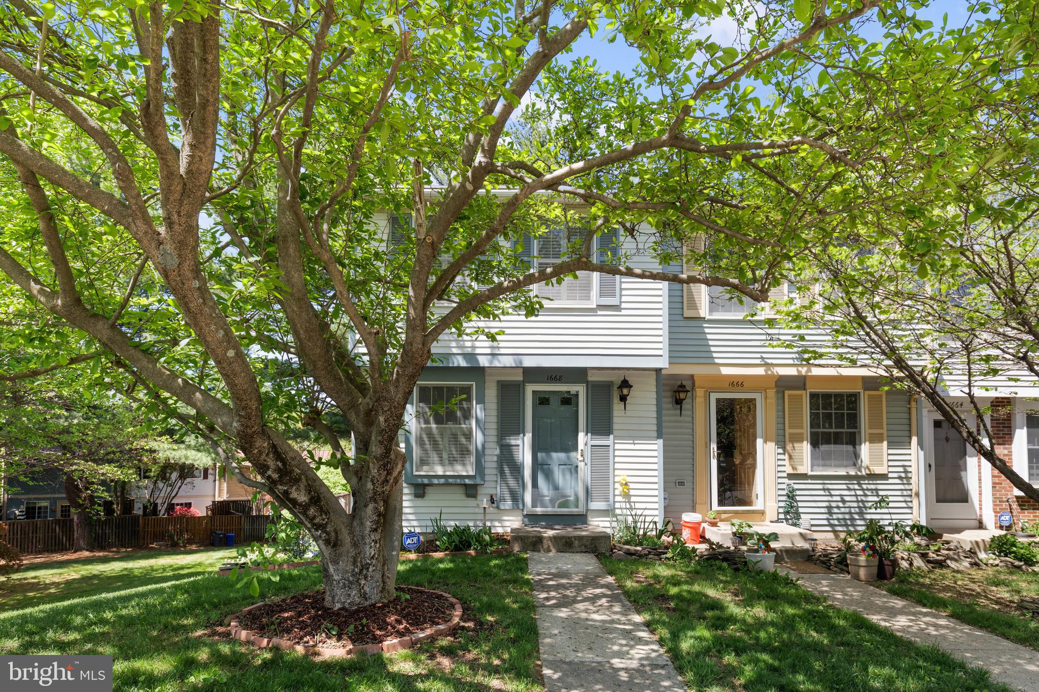 Welcome home to this charming end-unit townhouse in sought after Concord Green community of North Reston! Meticulously maintained and move in ready! Main level features a bright kitchen with thoughtful use of space that overlooks the spacious dining and living rooms with beautiful hardwood flooring. Upper level features two spacious bedrooms and upgraded full bath. Main bedroom also boasts a lovely vanity that has also been established for use as an office space.  The walkout lower level boasts a large rec room with tile flooring, half bath and laundry room. Step out onto the large outdoor deck into your own private retreat with beautiful greenery and tree view- truly one of a kind and serene.  Location is everything: Situated just a short walk to Northpoint Shopping Center and Fairfax Connector bus stop,  and just minutes to Reston Town Center and the Reston Metro. Tons of nearby shopping, dining, and entertainment. Enjoy all that Reston has to offer including indoor and outdoor pools, children’s playgrounds, miles of walking and hiking trails (the scenic Pink Trails), tennis and pickleball courts, and a calendar full of  events. Convenient commuter access to Fairfax County Parkway and Reston Parkway. Don't miss out!