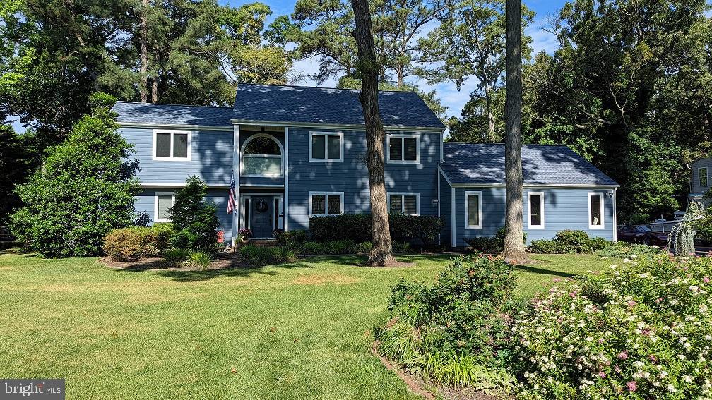 Welcome to your private oasis in the coveted community of Prospect Bay! This exceptional 3000 sq ft home offers direct access to Little Greenwood Creek via your private dock.  Launch your kayaks right from your backyard and paddle down Little Greenwood Creek out to the bay!  But first set your crab pots in the creek.  Relax and entertain effortlessly with an incredible covered patio featuring an outdoor kitchen, hot tub, and fireplace. A fire pit and fenced yard add to the allure.

Inside, enjoy high ceilings and abundant natural light.  The focal point of the living area is a charming double sided gas fireplace that splits the den from the living room, creating a cozy ambiance.   For ultimate convenience, a first-floor primary bedroom provides a luxurious and accessible retreat. The open layout is a host's dream, highlighted by a stylish wet bar with an ice maker and beverage refrigerator.

This is more than a home; it's your personal resort.. Community amenities include golf, tennis, clubhouse, marina, pool, and more, just minutes from the Bay Bridge