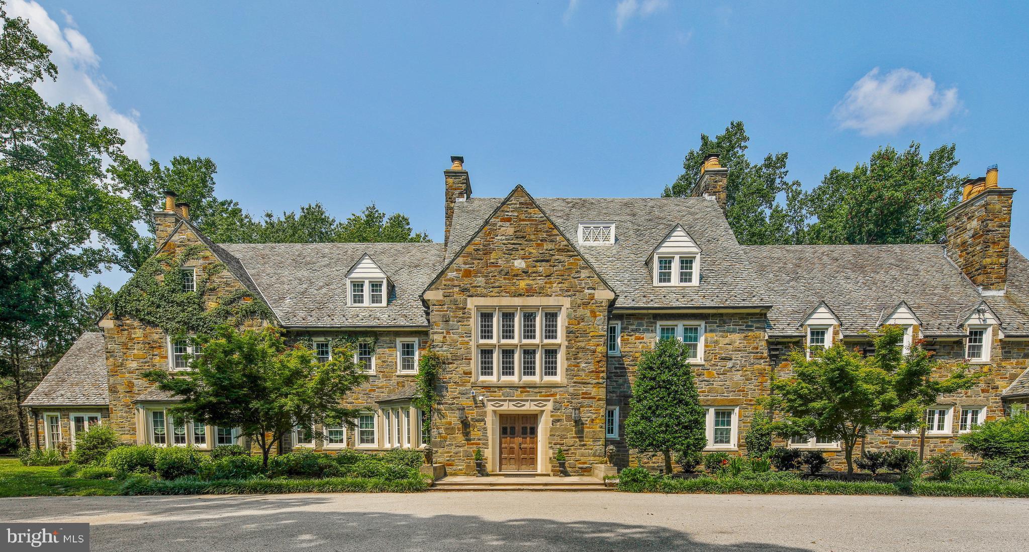 This Wynddon Estate home is a distinguished, all stone French country mansion built over three years in the late 1920s.  Precision craftsmanship, meticulous detail, opulent materials and gracious proportions have been expertly married to create this elegant and truly impressive stone mansion.  This gracious beauty retains the seductive character of her century-old design while providing every modern amenity and luxury one could ask for.  Exquisite millwork, stunning hardwood and hand-cut Italian marble floors, marble carved mantles, an elevator to every floor, numerous French doors and windows are just a few of the impressive characteristics of this palatial home. Every cook will adore the Lacanche imported French gas range, multiple butler pantries and abundant cabinetry and countertop space. The grounds and scenic vistas are no less stunning. The rear terrace boasts a manicured hedge garden, covered bluestone patio, two fish pools, a heated salt water pool (all new equipment and resurfaced in 2020) and a lantern-illuminated stone wall that cuts gracefully into the sloping hillside, allowing breathtaking views of sunsets over Loch Raven Reservoir, hovering just beyond the treeline.  This is a very special property waiting for the right new owner to be enchanted with! 3 ACRE BUILDABLE LOT ALSO AVAILABLE FOR PURCHASE