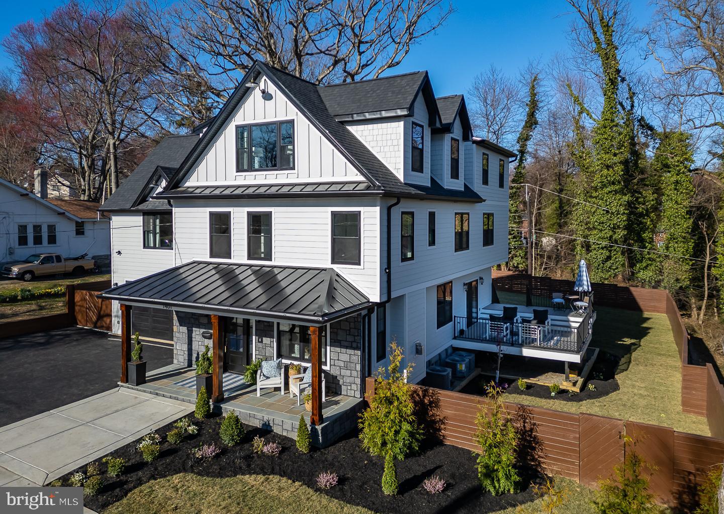 You have to see this new construction to believe it! This stunning seven-bedroom six bath stone colonial offers 5,200 square feet of spacious living. Situated in the desirable Beechwood neighborhood, this masterpiece includes many custom finishes. It’s also conveniently located just minutes from restaurants and shopping on the Main Line. Nestled amidst lush trees, the property features professional landscaping, mature plantings, and fully sodded grounds. The Jamie Harding Siding provides a modern aesthetic, and the Bluestone flag patio on the front porch offers an inviting introduction to this home's unique charm. The first floor features nine-foot ceilings, white oak plank flooring, Serena & Lily lighting, and specialty flush registers​. The living room's beauty is enhanced by a custom contemporary limestone fireplace, eight-inch custom baseboards, and oversized crown molding. The dining room features a custom coffered ceiling,  The  powder room has brick herringbone  walls and flooring; The kitchen is a chef’s dream, boasting white shaker cabinets, a Calacutta quartz waterfall island, GE Café Series matte white appliances & quartz countertops.  The open-concept connects the family room, which features a beautiful limestone fireplace, a custom wet bar, and sliding glass doors that open to your spectacular two-level Azek Vintage Collection Decking. The staircase is over four feet wide and features oak posts and railings. The primary bedroom is filled with beautiful natural sunlight and boasting stunning 13-foot ceilings with exposed beams, private outdoor patio and three closets, including a large walk-in closet. The ensuite is finished in pure white marble, inviting you to unwind in its soaking tub or wet shower.  This home could accommodate two in-law suites if desired. The first suite features a bedroom with two large closets and a full bath with his and her sinks. There are also two more full bedrooms which share a Jack and Jill bath; On the third floor, you'll find a grand living room featuring large windows and a convenient dry bar. This floor also offers two bedrooms or a great spot for an office; On the lower level, discover a climate-controlled wine cellar, complete with custom wine racks and elegant Herringbone brick flooring. There's also a large tiled recreation room, two more rooms, one enclosed could be a bedroom or storage and a full tiled bath.  This is a walk out and could serve as an au pair suite with its own private entrance.  Custom fencing provides privacy to the backyard; the two-car garage is equipped for all your future needs, featuring  a 220-volt outlet ready for electric vehicle charging. The driveway provides ample space for up to six additional cars, perfect for accommodating guests.  This property is ideally located near two township parks, Suburban Square's dining and shopping, the Beechwood Brookline trolley, and the R5 to NY. You'll find it just outside Philadelphia and a quick twenty-minute drive to Philadelphia Airport. Located in the excellent Haverford Township School District, don't miss your chance to own a newly constructed, move-in-ready home. (Taxes TBD).