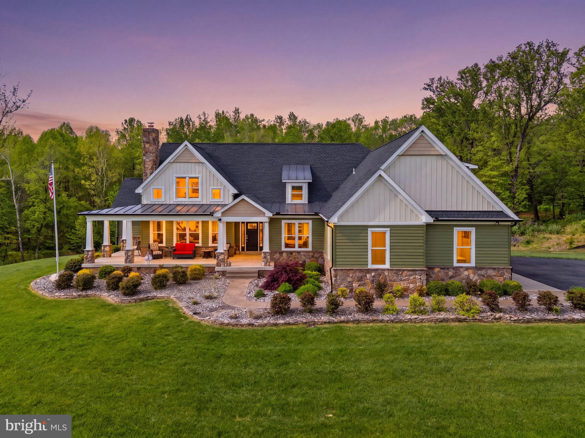 Open House Cancelled. Set on nearly 20 picturesque acres, this exceptional estate offers a rare blend of refined living and premier equestrian amenities. Thoughtfully designed and impeccably maintained, the property offers 6395 square feet and delivers both everyday comfort and unforgettable entertaining spaces.
From the moment you arrive, the home’s welcoming presence stands out, with a wraparound front porch perfect for quiet mornings and sunsets. Inside, the main level is anchored by a stunning living room featuring a cathedral ceiling with wood accent detail and a striking stone fireplace, creating a warm yet sophisticated gathering space.
The kitchen is equally impressive, designed for both function and style, with leathered granite countertops, stainless steel appliances, double ovens, a cooktop, generous bar seating, and a spacious dining area. Just off the kitchen, step out to a Trex deck with a covered section, ideal for seamless indoor-outdoor living.
The main-level primary suite is a true retreat, offering a spa-like bathroom with a custom tiled walk-in shower, soaking tub, double vanity, and a beautifully designed walk-in closet system. The primary suite also has its own private balcony. A dedicated main-level office, a large laundry room with a custom dog-wash station, and an oversized walk-in pantry add to the home’s thoughtful design.
Upstairs, you’ll find additional spacious bedrooms, including a private upper-level suite with its own full bath.
The fully finished walkout basement is an entertainer’s dream, filled with natural light and featuring a massive recreation area, custom bar, home gym, fifth bedroom, full bath, and even a hidden walk-in safe. Step directly outside to your backyard oasis.
Outdoors, the amenities are nothing short of incredible. Enjoy the in-ground pool surrounded by travertine tile, complete with a pool house (with future bar potential) and a 10-foot electric awning for shaded relaxation.
For equestrian or hobby enthusiasts, the property is unmatched:
85x40 detached building with extended 45’ bay—perfect for RV or “bus” storage
50x35 barn
240x100 riding arena
Dry lot and additional outbuildings, including a structure with a mini-split system ready for a future dog run!
3-car attached sideload garage! In-ground saltwater pool. 16x36, 3 ft to 8ft. 

This is more than a home, it’s a lifestyle. Private, expansive, and beautifully appointed, this one-of-a-kind property offers the space, flexibility, and luxury rarely found in a single offering.