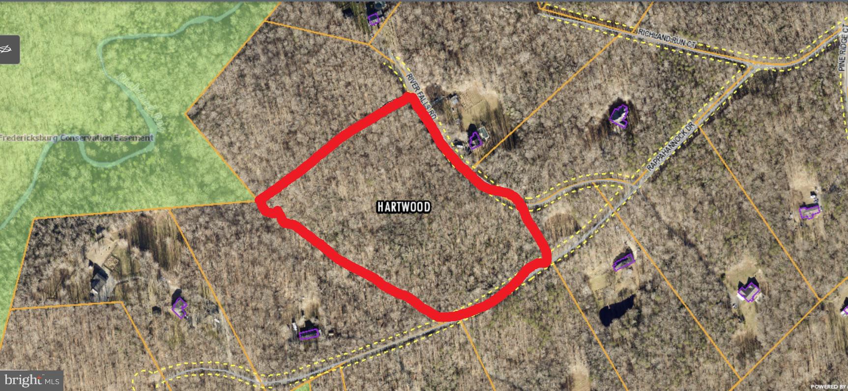 Lush, wooded 12-acre lot in a private estate community, just 9 miles from I-95. Raw land—perfect for building your dream home.
