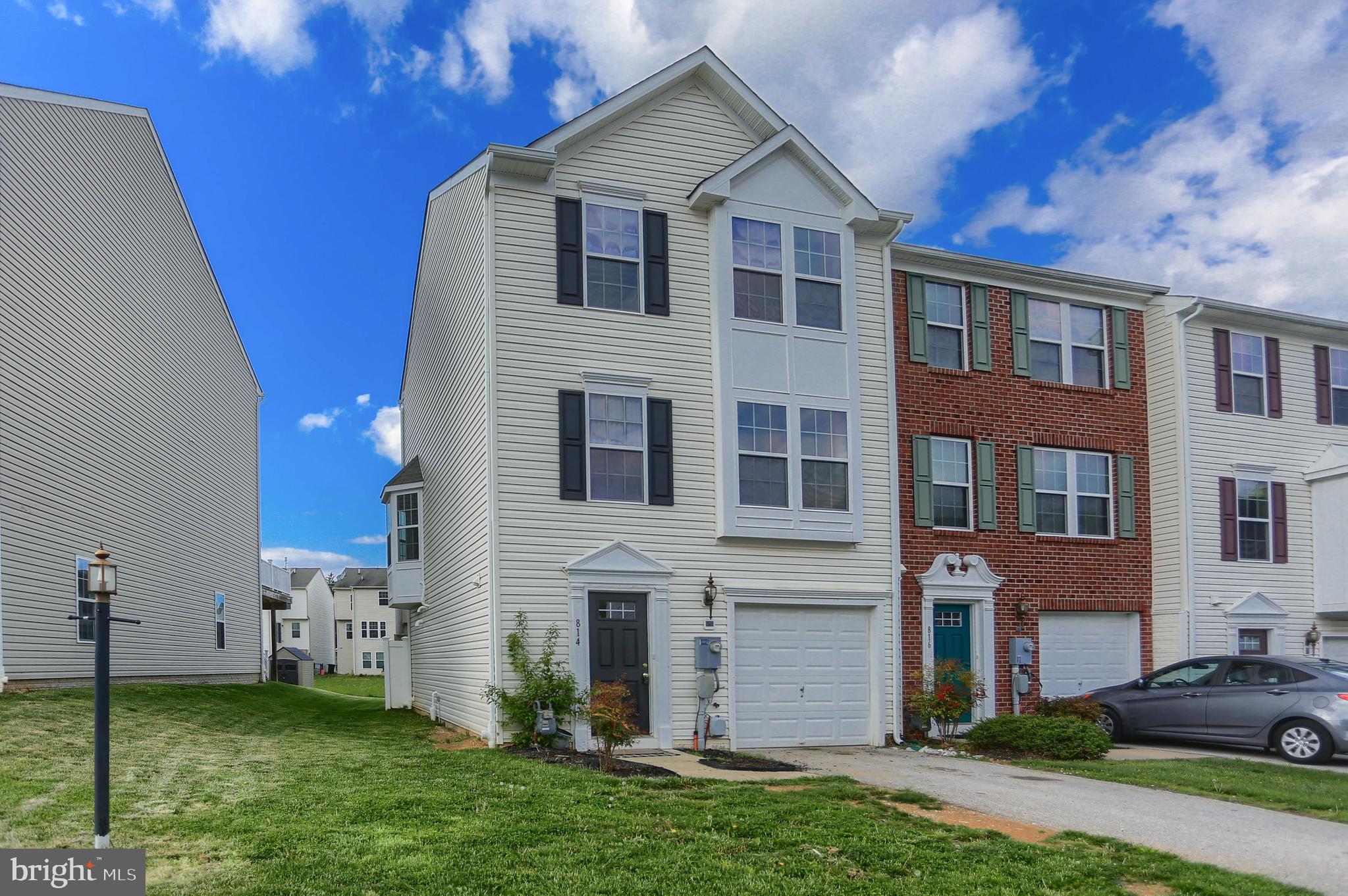 Like New End unit townhome freshly painted with new carpet.  3 levels with a 3 level bump out provides extra space on all levels.  An entry level garage, 1/2 bath and family room.  Laundry room with utility sink. 
 Walk out to the fully fenced yard.  Living room and kitchen with spacious eating area with bay window and sunroom.  Stove, Microwave, Refrigerator, and Dishwasher convey.  Built in sound system offers music to the living room, upper level, and back yard.  Also wired for a security system.  Primary suite with 2 walk in closets and large private bath with a double sink, garden tub and shower.  2 extra bedrooms and bath off the hallway.   Move right in !