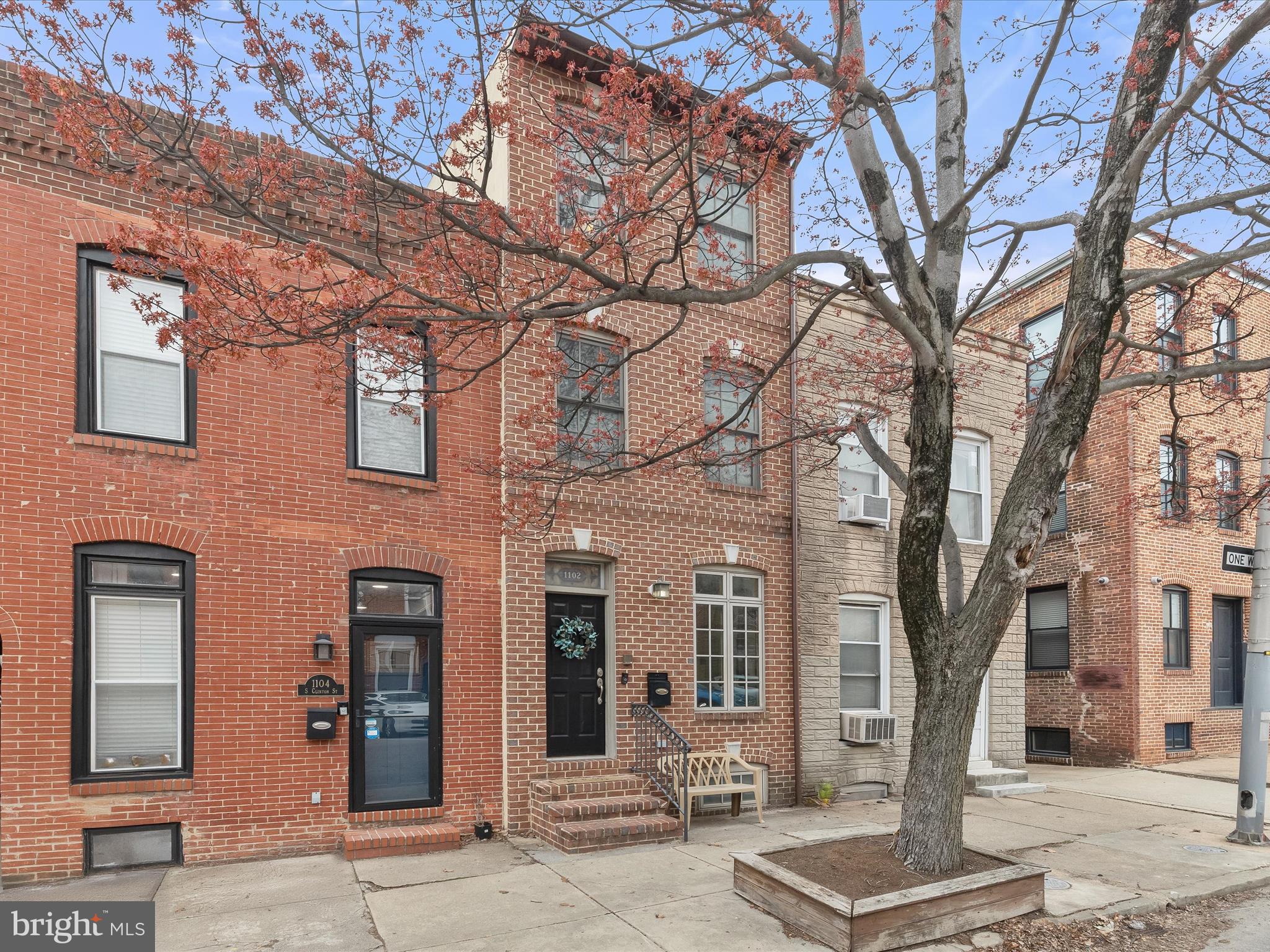 Stunning Brick Rowhome in the Heart of Canton!  Welcome to this beautiful brick-front rowhome nestled in the highly sought-after community of Canton—just steps from O'Donnell Square, Canton Waterfront, and endless shopping, dining, and entertainment options.  Step inside to an open-concept main level adorned with exposed brick accent walls, soaring ceilings, and gleaming hardwood floors. The chef’s kitchen is a true showstopper, featuring 42” cabinetry, granite countertops, stainless steel appliances, gas cooking, a double sink, a pantry, a breakfast bar, and modern lighting.  Beyond the kitchen, you'll find an impressive sitting room—rare for the area—complete with a vaulted ceiling, skylights, a cozy gas fireplace, and access to the rear patio, perfect for summer grilling.  Retreat to the luxurious penthouse-level primary suite, offering ultimate privacy with a vaulted ceiling, hardwood floors, a wet bar, a walk-in closet, and a spa-inspired ensuite bath featuring a jetted soaking tub, double vanity, and a walk-in glass-enclosed shower.  The second level offers two generously sized bedrooms and a full hall bath.  The fully finished lower level provides flexible space for a home office, media room, playroom, or guest area.  And don’t miss the new rooftop deck—an entertainer’s dream with sweeping city views!  Recent updates include a new roof, skylights, solar-powered blinds, and a new washer and dryer. Easy access to major commuter routes, including I-95, I-83, and I-895.  Don't miss your chance to own this exceptional home in one of Baltimore’s most vibrant neighborhoods!