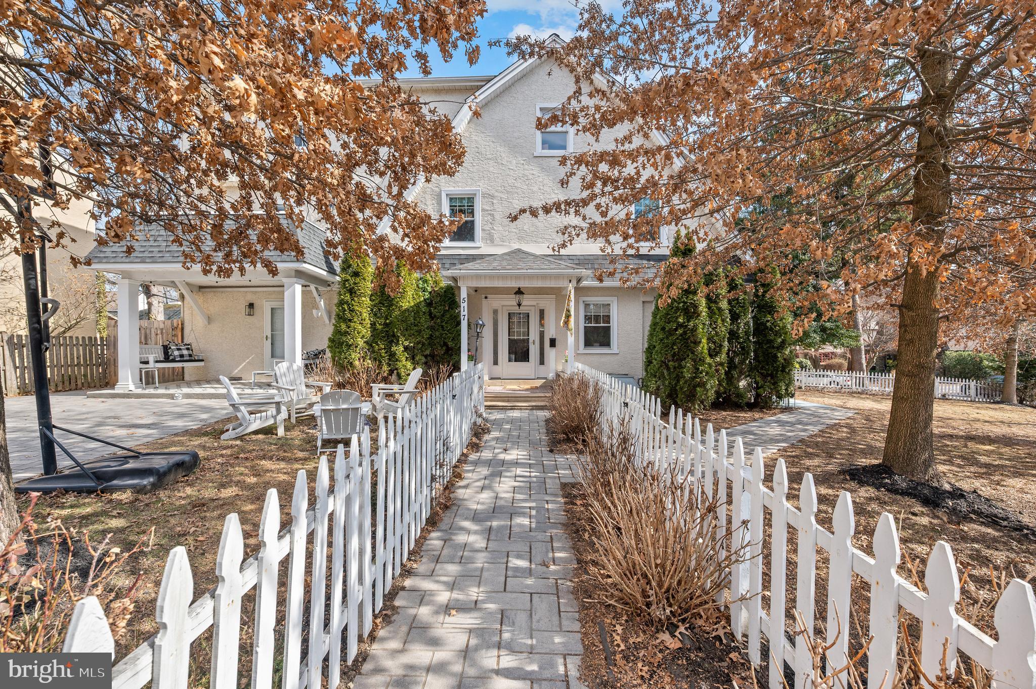 You do not want to miss this turn-key Narberth gem in a wonderful neighborhood!  Welcome to 517 Merwyn Road nestled on a quiet, sidewalk and tree lined street, yet walkable to everything that idyllic Narberth has to offer.  This home boasts 5 bedrooms, and 4 full bathrooms, including a full bathroom on the first floor. Originally built in 1925, the prior and current owners have thoughtfully curated this home to its current expansive state offering over 3700 square feet of living space.  The extensive renovations and reimagination of this center hall colonial resulted in the perfect combination of an open flowing floor plan with modern amenities, while preserving the older character and charm.  This home features fabulous curb appeal with a perfectly pointed driveway and walkway to the front door, extensive landscaping, a perennial garden, a shed, and a large side flat yard lined with a white picket fence.  Open the front door to a magnificent foyer area featuring the gorgeous staircase to the upper levels.  To your right, is an open sunlit sitting area with a wood burning fireplace.  There is a side door off this room leading out to the flagstone patio perfect for outdoor entertaining!  This area flows directly into a beautiful dining area and gourmet kitchen, fully renovated in 2019. The kitchen is white and bright, featuring a stainless steel sub zero refrigerator, GE Profile natural gas oven and microwave, Bosch dishwasher, undermount sink and ample cabinet and pantry storage. The countertops are a light solid surface complete with a tile backsplash which compliment the white cabinetry.  The left of the large foyer is a  spacious living room, complete with a full newer bathroom.  You can also enter this living room from the kitchen.  This living room also has its own door to the front of the property, and a charming covered front porch.   Beautiful hardwood floors and craftsman style moldings run throughout the home.  On the 2nd level you will find an extra large primary suite.  Enter the suite through a "bonus" sitting area/changing room, and then step up to the primary bedroom, and en-suite a full, newer bathroom and laundry area.  Directly off the primary suite is a private renovated porch with an electric awning - the perfect spot to relax with morning coffee! The 2nd level is complete with 2 additional bedrooms, and a full hall bathroom with bathtub.  Continue up to the 3rd level of the home to see the 2 additional spacious bedrooms with abundant closet space, and another full, newer bathroom.  The 3rd floor offers so much possibility including: home office/gym space, au pair/in-law guest quarters or playroom!  Endless possibilities!  The lower level is unfinished, providing ample storage space and another laundry area, as well as Bilco doors to the outside.  This home is located in the ultra convenient town of Narberth, walkable to the train to Center City Philadelphia, shops, restaurants, and coffee shops.  Downtown Narberth offers music and arts festivals, youth sports activities at the park, weekend farmers markets, and of course, the famous 4th of July Fireworks celebration!  This home is also just minutes away from Whole Foods, Trader Joe's and Suburban Square.  It is also situated in the top rated Lower Merion School District.  This home is walkable to Merion Elementary School, a nationally recognized Blue Ribbon school of excellence.  Please also inquire about  ALL the recent improvements by the current owners, including  most recently all brand new Viwinco windows on the 2nd floor (to match the first floor), and the home was just freshly painted throughout!  Schedule your appointment today!