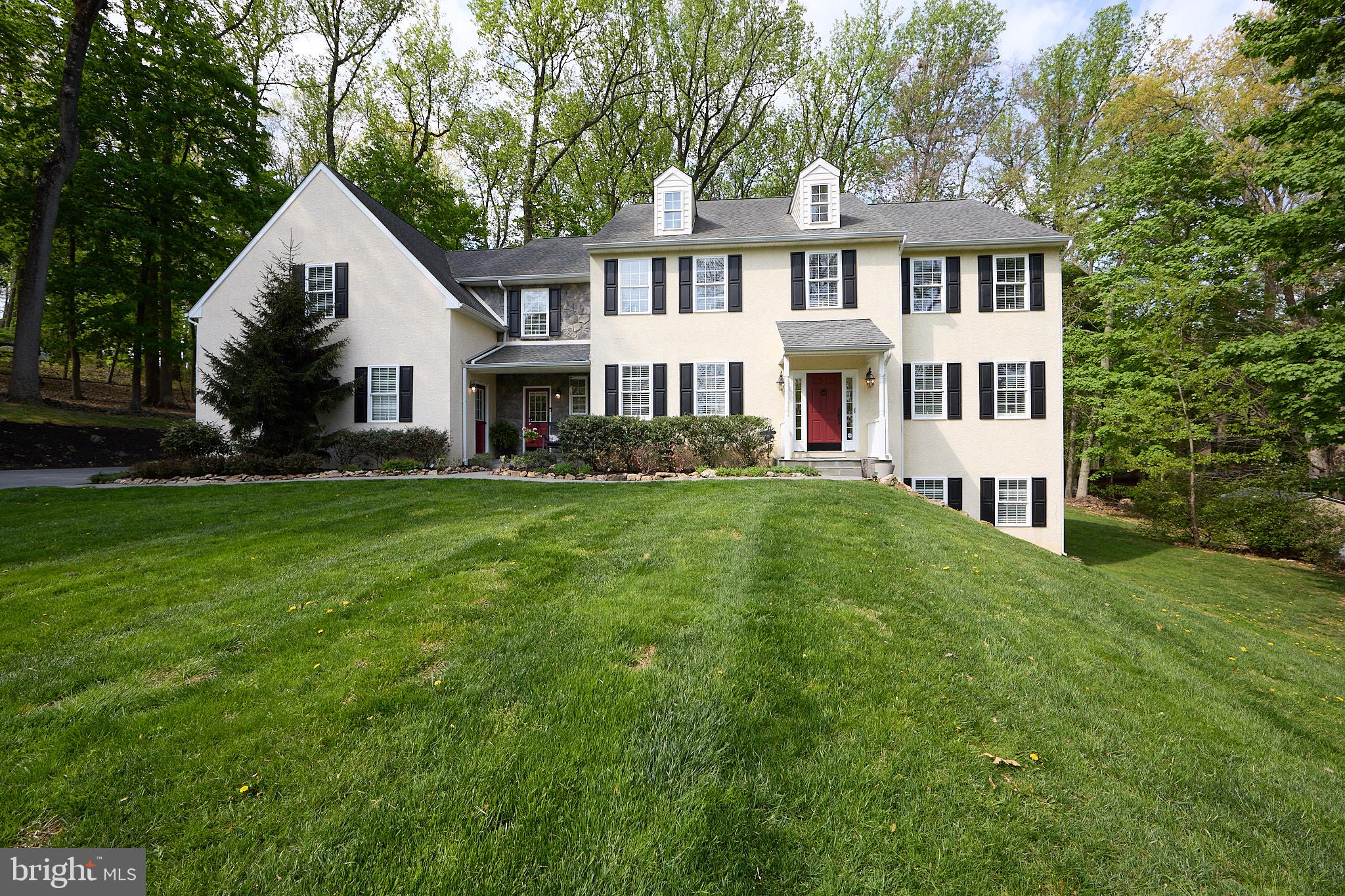 Welcome to 661 St. Matthew’s Road—an exceptional custom home set on a picturesque 1.3-acre lot in the heart of Chester Springs. Offering over 4,055 sq ft of above-grade living space (per public records), plus additional finished lower level (930 sq ft)and addt'l in law suite or private suite  (1BR and 1 bath) (640 sq ft), this home blends timeless elegance with modern functionality and shows like new construction.

A grand hardwood foyer welcomes you, flanked by a formal living room and a Formal Dining Roomw/ French Doors and Hardwood floors. There is also a private study w/ French doors featuring detailed millwork—ideal for today’s work-from-home lifestyle. The impressive family room showcases a vaulted ceiling, gas fireplace, built-in speakers, and direct access to the expansive deck, creating a warm and inviting space for everyday living and entertaining.

At the center of the home, the gourmet kitchen is designed to impress, featuring 42” KraftMaid off white cabinetry, granite countertops, subway tile backsplash, stainless steel GE appliances including double ovens, gas cooktop, microwave, dishwasher, beverage cooler and a large center island with seating. A bright breakfast area opens to the 12x22 maintenance-free deck (2022), perfect for seamless indoor-outdoor living. There is also a powder room w/ hardwood floors, Laundry area and a Mudroom w/ second entrance from the front.

Upstairs, the luxurious primary suite w/ new carpet offers a tray ceiling, spacious sitting room, and a spa-inspired bath complete with heated travertine floors, glass-enclosed shower, jetted tub, and dual granite vanities. Three additional bedrooms w/ new carpet provide comfort and flexibility.

A standout feature of the home is the private in-law or extended living suite (approx. 640 sq ft), thoughtfully designed with its own entrance on the main level and private stair access to the suite. A convenient desk area greets you along with the TV room, Bedroom and Full Bath—ideal for multi-generational living, guests or a secluded retreat.

The finished walkout basemen has lots of windows and adds even more versatility with space for recreation, fitness, entertaining, and storage.

Outdoor living is equally impressive with a maintenance-free deck, stamped concrete patio, firepit, and invisible fence w/ collars—perfect for enjoying the serene surroundings.

Extensive updates provide peace of mind, including major systems replaced in 2017, a whole-house generator (2020), Audio System, Front and Back stairs and many interior updates (2021), and more. The widened driveway allows for easy parking and smooth entry and exit, complemented by a 3-car garage.

A rare opportunity to own a meticulously maintained, move-in-ready home in one of Chester Springs’ most desirable settings. It is close to all major routes- Turnpike, Rts 100, 401 and 202.  Show and Sell!!