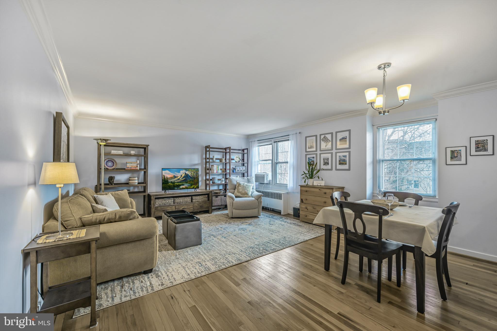 Step into #204, a charming and sun-filled 1-bedroom, 1-bathroom home, offering over 730 sq. ft. of thoughtfully designed living space on the top floor. With large, bright windows in both the living/dining area and bedroom, natural light floods the unit— especially in the afternoon— creating a warm and inviting atmosphere.

The open-concept layout highlights the beautiful hardwood floors, while elegant crown molding adds a touch of sophistication throughout. The renovated kitchen features modern finishes, perfect for cooking and entertaining. The bathroom boasts a stunning pedestal sink, adding classic charm, and the entire home has been freshly painted, ready for you to move right in.

This top floor home offers the possibility of  creating vaulted ceilings and/or a loft space that might include a bedroom and full bathroom, all above the current ceilings. Ample closet space ensures storage is never an issue, and the convenience of nearby public transportation makes commuting a breeze. Plus, your condo fee includes your electricity, gas, water and sewer utilities, and you’re just minutes from shops, restaurants, and all that Silver Spring has to offer.

Don’t miss this opportunity to own a bright, stylish, and conveniently located home!