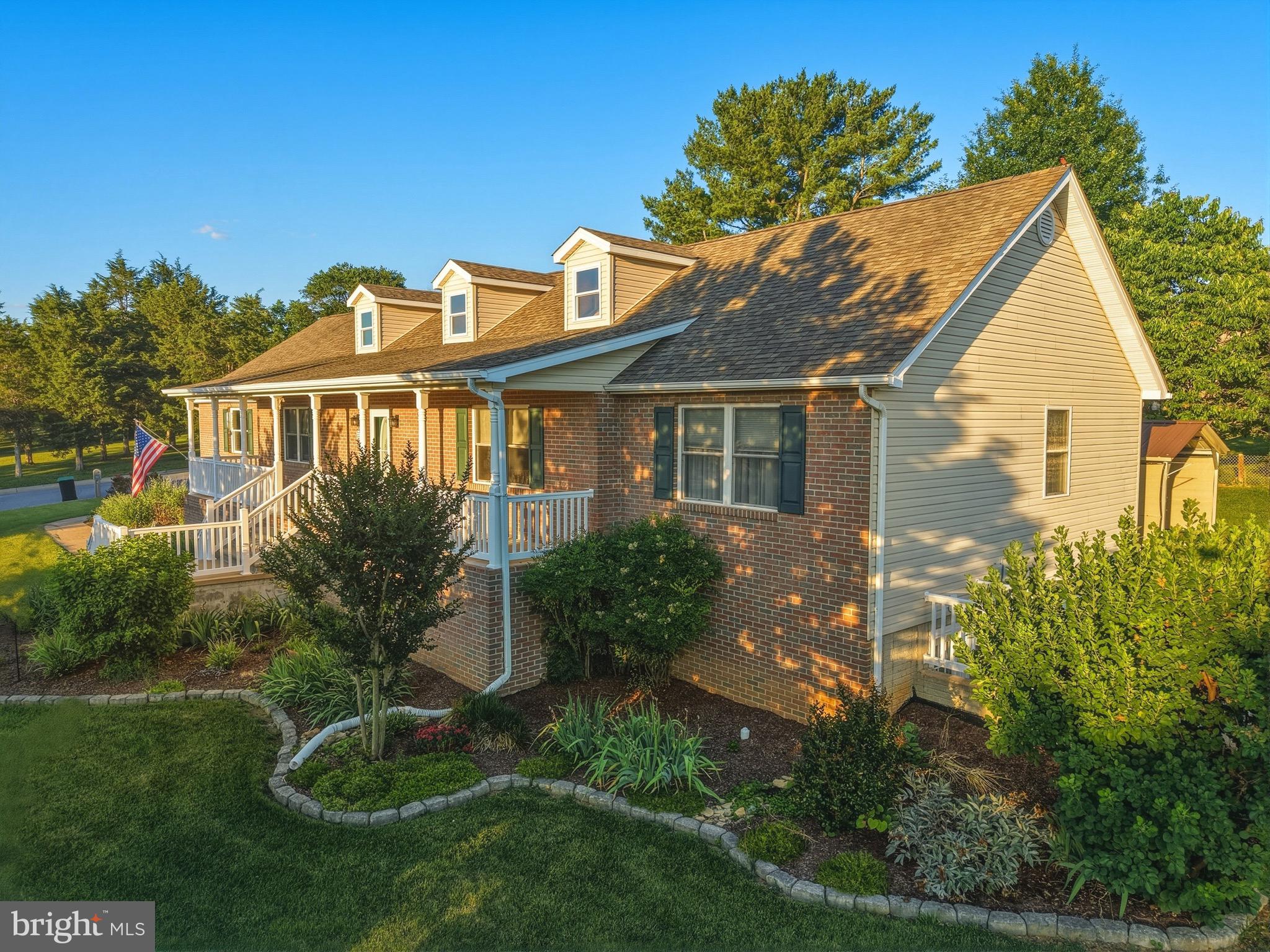 Welcome home to this beautifully maintained brick rancher in the heart of Woodstock! Situated on a desirable corner lot with mountain views, this immaculate home offers the perfect blend of comfort, space, and thoughtful updates.

Step inside to discover a bright and inviting main level featuring beautiful bamboo flooring throughout the main level. The spacious living room is filled with natural light from the all the windows, creating the perfect place to relax while enjoying the  views. The remodeled kitchen is truly the heart of the home, thoughtfully designed with upgraded countertops, stainless steel appliances, abundant cabinetry, a pantry, convenient bar stool seating, and a gorgeous tile backsplash that beautifully ties the entire space together. From the carefully selected finishes to the stylish details throughout, this kitchen offers both elegance and functionality with plenty of workspace for preparing meals. Just off the kitchen, you’ll find a convenient laundry room, while the adjoining dining area provides ample space for gathering with family and friends.

The main level also features a spacious primary suite complete with a walk-in closet and an attached bath featuring a soaking tub, walk-in shower, and generous vanity space. Two additional bedrooms and a full hall bath complete the main level.

The partially finished lower level offers outstanding flexibility with a private bedroom, full bath, and a spacious family room—ideal for guests, extended living, or a private retreat. An additional unfinished area is currently used as a workshop and provides excellent storage, hobby space, or room for future expansion.

Outdoor living is just as impressive! Enjoy your morning coffee or unwind in the lovely screened porch, then step onto the adjoining deck that’s perfect for grilling and entertaining. The welcoming front porch provides another wonderful space to sit back and take in the peaceful surroundings. Additional features include an attached two-car garage with extra storage space and a metal carport for even more covered parking.

Meticulously cared for and truly move-in ready, this exceptional home showcases pride of ownership throughout. Don’t miss the opportunity to make this stunning Woodstock property your next home!