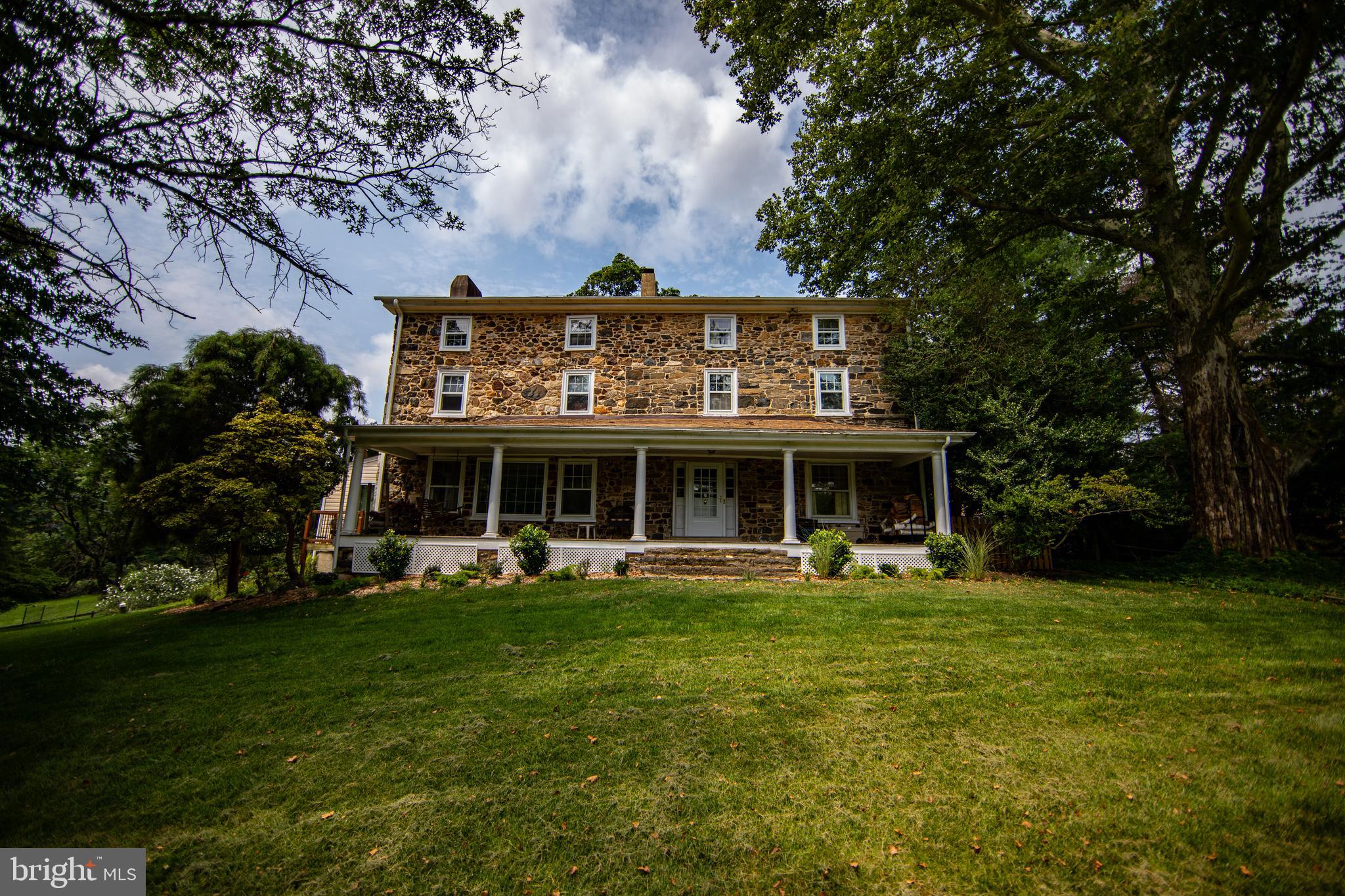 Welcome to 18th Century Sprucehaven Farm, on sprawling 7.2+/- acres in all its perennial glory. Most notably graced by its London Plane tree, the 6th largest in Pennsylvania. Construction of this stone coursed fieldstone Federal style estate, began c.1734. Owners demonstrate pride of ownership in their respect for its historical significance, coupled with effectively investing in quality upgrades and enduring enhancements to stand the test of time for years to come. Impressive Valleybrook entrance, a 315' long, flat setback befitting this stately property. Full length front porch. Charming center foyer fireplace & curved staircase. The hardwood floors throughout this home are magnificent. Authentic neutral colors on plaster walls w/ coordinating tones on woodwork & built-in cabinetry, deep sills throughout. Parlor living room to your right. A spacious Gathering Room to your left offering a generously sized wood fireplace, affords comfort for your entertaining. Formal dining room to the rear, leading to a large kitchen with updated quartz counters, stainless appliances, tile floor. Breakfast area with built ins & wood stove, plus an added ceiling fan, replaced skylight & rebuilt deck. Converted Four Season Sunroom with replaced energy efficient storm windows, tile flooring, propane stove, mounted mini-split heat pump, copper roof with interior wood accent ceiling, & 2023 Hunter Douglas 3/4 light filtering motorized duette shades with timer App! First floor Powder Room with stackable washer & dryer. All new storm doors. Storm windows have been replaced as well on the 1st & 2nd floors plus sliding doors (only) in eat in kitchen. Most roofs replaced including lower roofs on main house, office, barn, shed, & cistern. Second floor cozy & quaint En Suite BR/bath & added fireplace. Second En Suite BR & bath with bump out closet setting. Third bedroom & a thoroughly updated hall bath. The third floor has two generously sized bedrooms & a beautiful redesigned, rebuilt & repiped full bath. Bring your horses home for boarding and grazing, to a conversion of the bank barn into a 3 stall horse barn w/tack room & upper floor hay & feed storage. The approx 1/3 acre barnyard is intentionally outfitted with a special "dry lot" to prevent mud accumulation and erosion. Root cellar. Not one but two one acre (approx) pastures each with heavy duty no climb steel fencing with oak top boards and 4x4 post. Special pasture grass which grows early, faster, thicker, and deeper rooted. The Heather Lane entrance sports its own 3 car parking, & leads to a converted 1875 cow barn/carriage house, most recently upgraded as an approx. 1500 sq ft business office, with covered entrance, comfortable waiting room with powder room & two additional large rooms.  Might you need a separate au pair suite or in law quarters instead? With a little additional conversion, voila! Provisions to this building are propane heat & electric A/C, septic tie in, well tie in, modern electrical service & wiring, separately metered & insulated. There is a three car detached garage with storage. Plus additional storage shed. A once unused well has been tapped at the bottom of the cistern, installed pump & water lines to service both the horse barn and the office. Installed is a complete septic system which serves the house and the office. Care and attention given to driveways, walkways, patio, stone walls. Installed heat pumps & ductwork for whole house HVAC. Installed whole house water softening system. Installed new circuit breaker box, whole house surge protector & wiring to allow a generator to provide service to major house systems. Additional BSM hook up for washer and dryer. This lovely 7+ acre property is bordered by Chester Heights Community Park!  Convenient to shopping, dining, arts, medical needs. Also! Quick access to I-95, brand new Wawa Train Station, Airport, Philly, Wilmington and Shore Points. A perfect blend of yesterday, today and tomorrow awaits.