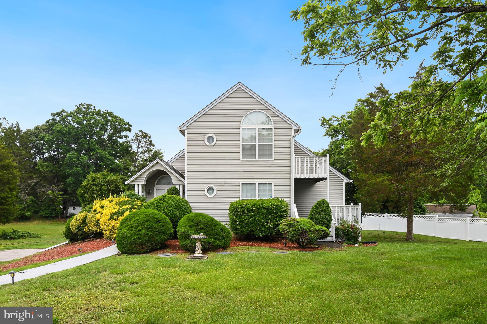 This modern waterfront home in Spring Grove features Patuxent River views at the front and protected cove access at the rear, providing water views from both sides. The open floor plan with vaulted ceilings creates a spacious, light-filled atmosphere. The property includes four bedrooms, three and a half baths, and generous storage throughout. The interior was repainted several years ago. Outdoor amenities include a large rear deck, multiple surrounding decks, a screened porch, a side-loading garage, and a sizable backyard with access to boat docks. Residents can also enjoy local events and concerts in Solomons. The home offers convenient access to Pax River Naval Base. This property is an excellent opportunity for those seeking premium waterfront living.