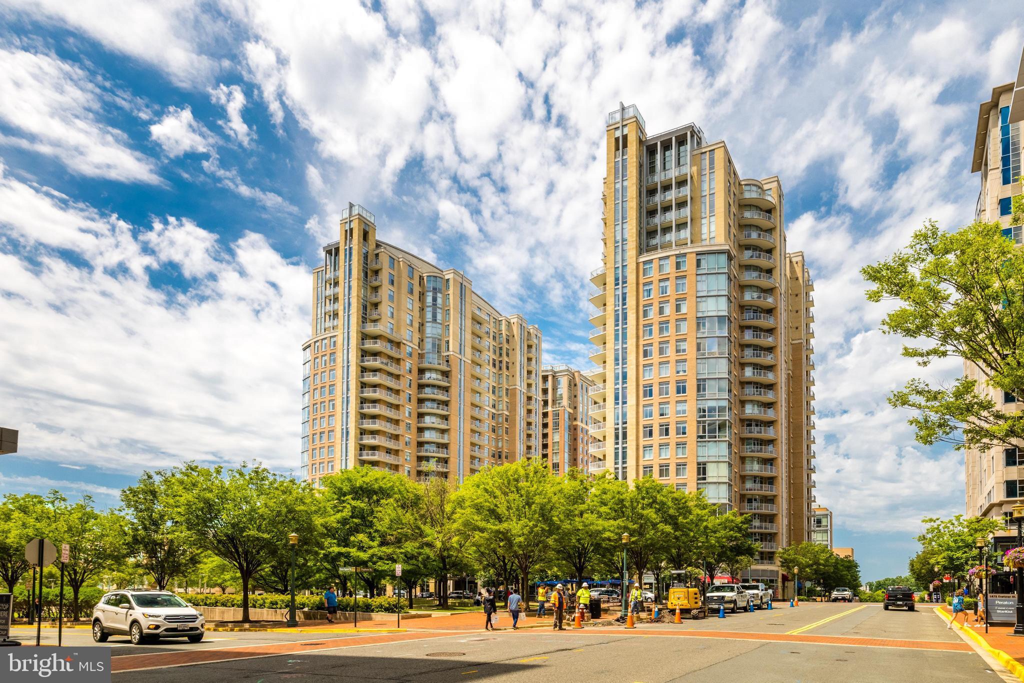 This 2 bedroom 2 bath condo in Midtown has been updated with new waterproof LVT flooring throughout. Kitchen features stainless steel appliances and granite countertops w/ breakfast bar. Dual master suite floorplan with bonus built-ins for storage (can be removed easily.) Light-filled LR/DR combo. Enjoy amazing sunsets from your enclosed sunroom with spectacular views to the west. One premium garage parking space conveys. Enjoy all of the amenities that Midtown has to offer including concierge service.