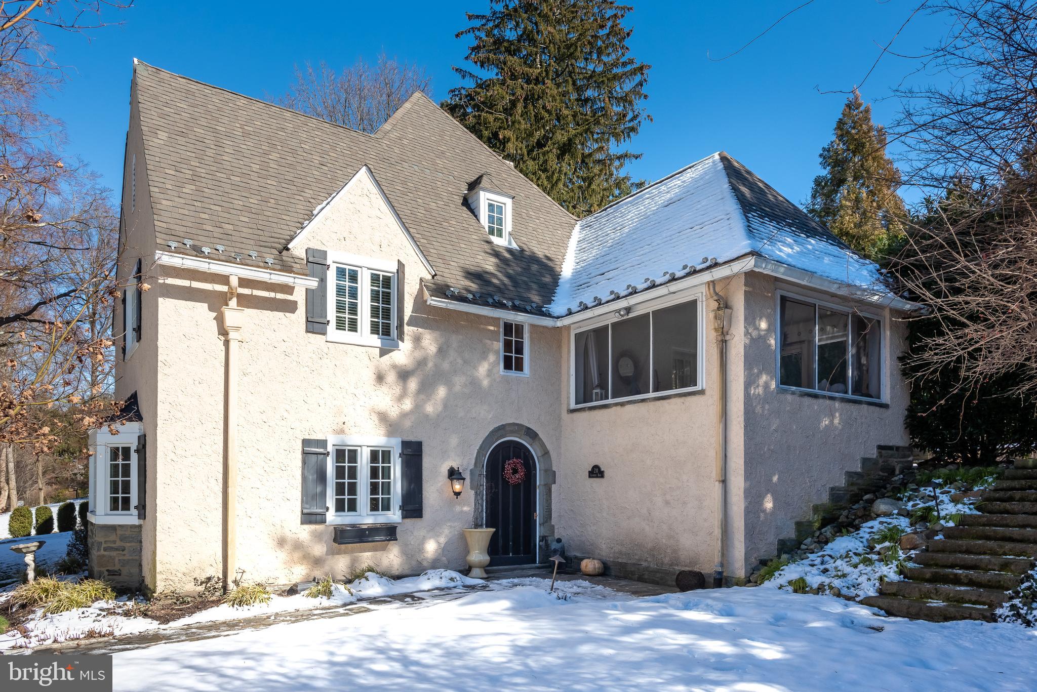 Decide now to buy this fabulous 5 BR 3.5 bath home on a quiet cul-de-sac in prestigious North Side Bryn Mawr. Since taking ownership, the sellers have spent over $200,000 in upgrades with newer windows, remodeled bathrooms, newer HVAC units and extensive heart scaping and landscaping.  Enter the foyer to the delight of original Mercer Tile flooring and into the room currently in use as a dining room. This space can easily be used as a family/living room if desired. The eat-in kitchen is ultra gourmet with granite tops and SS appliances including an Italian made F.lli BERTAZZONI 6 burner gas oven, Pasta pot filler, Brogan hood and a 5-yr young Kitchen Aide Refrigerator. The au-pair suite with full bath is accessed through the back steps off the kitchen. First floor laundry is off the kitchen and features the original tile flooring and cabinetry. An office/den is on the main level and the remodeled powder room completes the first level. A large 2nd floor family room features a gorgeous stone surround gas fireplace, entry to a lovely 3 season covered porch and is ground level to the private back yard. Walk up 3 steps to Main Bedroom with full bath, hall full bath and two additional bedrooms. Keep going to the 3rd floor boasting a huge bedroom & access to the unfinished attic area. The glistening hardwood flooring on the second and third levels were refinished (2019), all three full baths were upgraded and remodeled (2020-2021), two HVAC/furnaces replaced (2020-2021), laundry room and kitchen appliances are newer and the powder room was redone. Sellers have also installed a water softener and reverse osmosis system. On the exterior, the sellers installed a waterfall that flows into a lily pond with perennials, created 2 new flagstone patios, created retaining walls (stone & wood) with perennials and replaced the stairs for secondary access to the back yard and added shrubs and trees. The porch flooring has been replaced with modern tile and new exit stairs from the kitchen along with a newly paved seating area were completed in 2021. The upcoming warm days and evenings are very enjoyable in this zen like state out back. This beautiful home was built in 1922 and is not your ordinary house. If you love the Storybook Style Architecture that originated in Cotswold England, this is the house for you. Enjoy a special piece of Main Line history in architecture with a very unique floor plan and location. Walk to everything from this beautiful neighborhood.