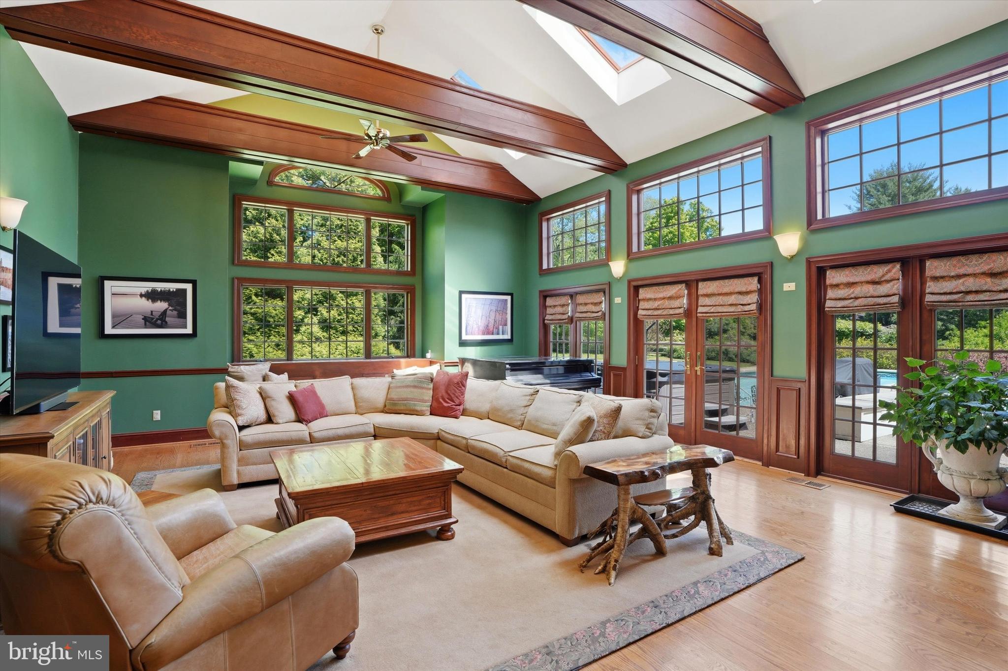 Set on nearly an acre of private, tree-lined grounds at the end of a quiet cul-de-sac, 851 Box Hill Lane captures the warmth, scale, and everyday livability that make Wayne homes so enduringly desirable.

Inside, timeless architectural details blend effortlessly with spacious, light-filled interiors and a floor plan that lives beautifully. Hardwood floors run throughout the home, while elegant formal living and dining rooms, detailed moldings, and multiple fireplaces create a sense of understated sophistication rarely found in newer construction.

At the heart of the home, the expansive kitchen is designed to gather people naturally, featuring custom cabinetry, premium appliances, gas cooking, double ovens, and a large center island. The kitchen flows naturally into the breakfast room overlooking the pool and rear grounds, as well as the vaulted great room filled with natural light from oversized windows, creating an easy flow throughout the home’s main living spaces.

A fireside library with built-ins offers the perfect retreat for reading or working from home, while an additional private office provides valuable extra space for today’s lifestyle. The back staircase adds both charm and practicality, enhancing the home’s thoughtful layout.

Upstairs, the primary suite feels tucked away and private, complete with a sitting room and fireplace, a spacious walk-in closet, and an updated bath with timeless finishes. Additional bedrooms are generously sized and thoughtfully positioned for family, guests, or office space.

Outside, the property truly comes to life. The in-ground pool and spa are surrounded by mature landscaping and expansive patio areas that create a peaceful backyard setting equally suited for summer entertaining or relaxed evenings at home. The grounds feel secluded and serene while still being moments from everything Wayne has to offer. The setting feels remarkably private for such a convenient Main Line location.

Additional highlights include extensive storage, main-floor laundry, a full basement with future potential, a two-car attached garage, and an additional mini garage ideal for bikes, golf clubs, or additional storage.

Located within the award-winning Tredyffrin-Easttown School District and just minutes from downtown Wayne, the R5 train line, shopping, dining, commuter routes, and golf courses, 851 Box Hill Lane offers the privacy, comfort, and everyday livability that buyers rarely find in such a convenient Wayne location.