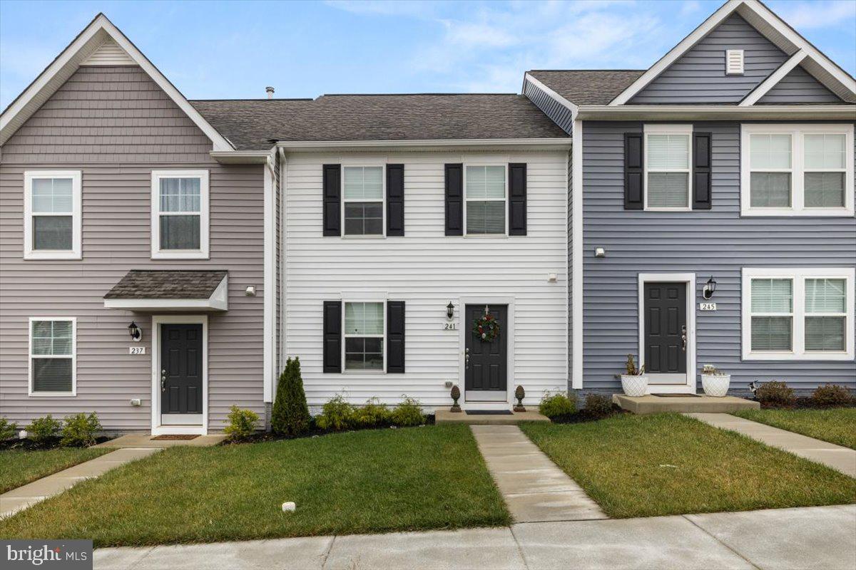 This charming 2- level town home is in excellent condition and move in ready! It features an open concept floor plan with gourmet kitchen a spacious quartz island, stainless appliances and Luxury VP flooring.  There is room for a dining table in addition to the seating at the island, which makes this a great place to entertain in.  There are 2 full baths on the upper level along with the 3 bedrooms.  There is parking in the back and street parking in the front. Plus a patio space to relax and enjoy the outdoors.  This community is minutes from restaurants, shopping, hiking and trails as well as commuter routes to both Virginia and Maryland.  Call today to schedule an appointment this one won't last long!