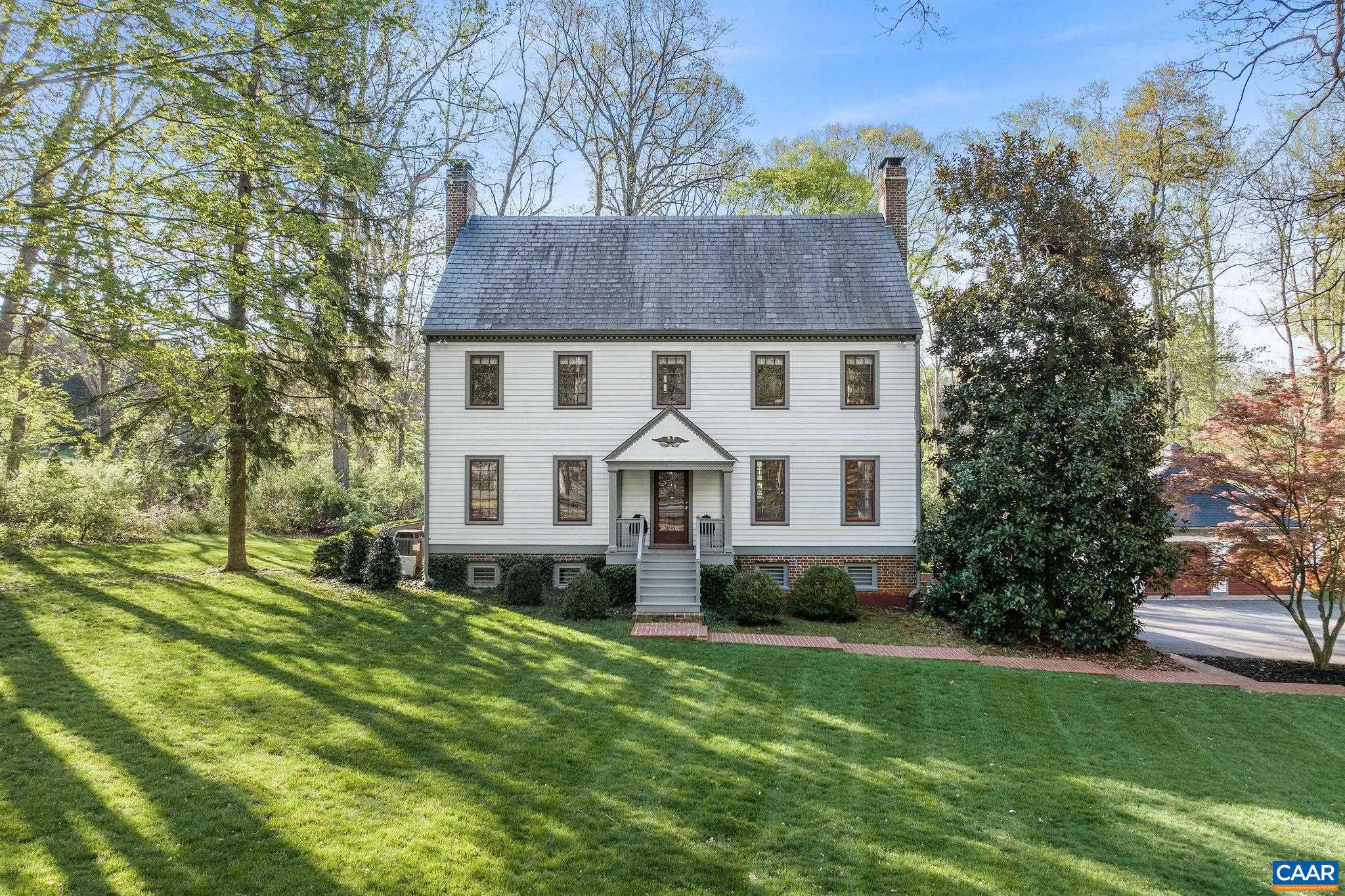 Set on one of Ednam Forest's most beautiful (and level!) parcels, this welcoming 5 bedroom offers incredible construction quality, a wonderful floor plan & lovely renovations over the years, incl' a timeless Karen Turner kitchen.  Constructed in 1969 but inspired by homes in Historic Williamsburg, the home boasts Flemish bond brickwork, slate roof, beautiful reclaimed heart pine floors, high ceilings, 4 fireplaces & stunning trim work. The generously proportioned foyer runs the width of the home thus upon entering the home, one sees through to the rear lawns.  The wonderful kitchen flows out to an expansive covered rear porch via 2 sets of French doors. There is a huge, blue stone terrace as well. These outdoor spaces are ideal for entertaining  & casual living alike.  Mature hardwoods dot the rear lawn, which is defined by numerous large boxwoods.  There is even a small formal garden, again inspired by Historic Williamsburg. A trail from the back lawn can be re-established to provide direct access to the Boar's Head/Birdwood trail system.  The Sports Club is a 2 minute bike ride or 6 minute walk away.,Solid Surface Counter,Fireplace in Family Room,Fireplace in Kitchen,Fireplace in Living Room,Fireplace in Master Bedroom