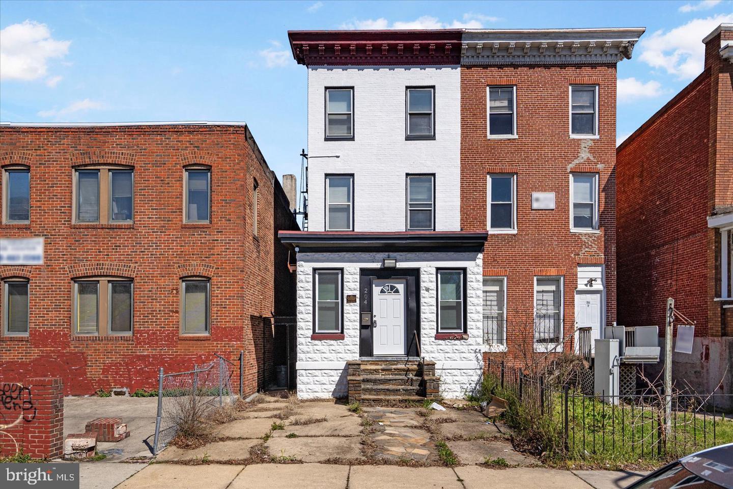 Prime commercial opportunity in Baltimore's desirable Charles Village neighborhood. This impressive Federal-style building offers 4,230 sq ft of versatile space across three floors, plus an additional 990 sq ft unfinished basement ideal for storage or equipment room. The expansive rear portion provides exceptional flexibility — perfect for a meeting area, gym, storage, or customized workspace. Conveniently located near major employment nodes, public transportation, schools, and retail amenities. A rare find offering endless possibilities for professional office, medical, or multi-use purposes. Schedule your showing today
